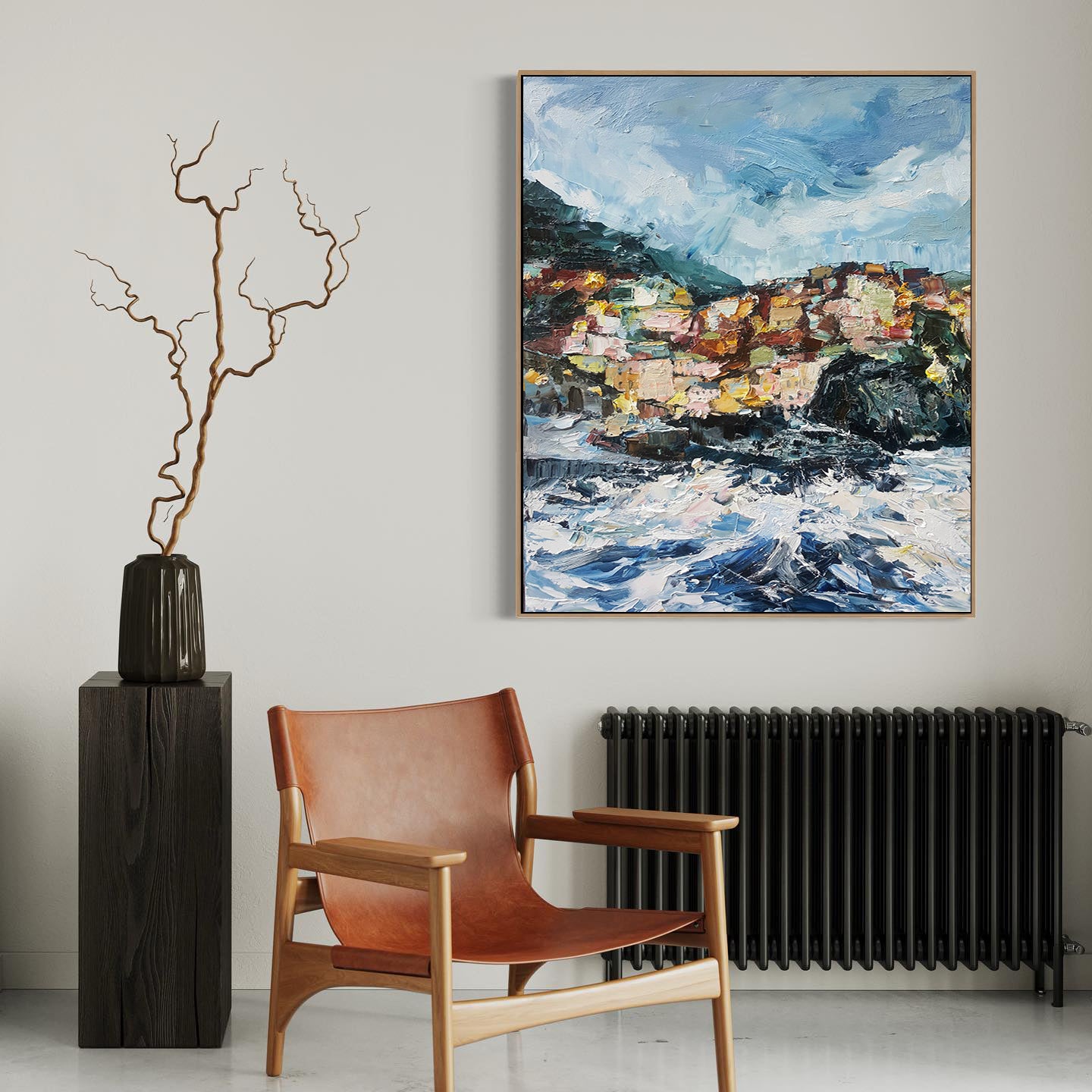 a painting hanging on a wall next to a chair