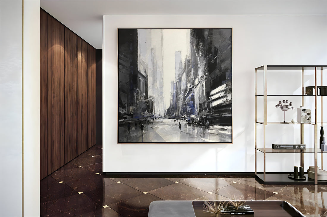 a painting of a cityscape hangs on a wall