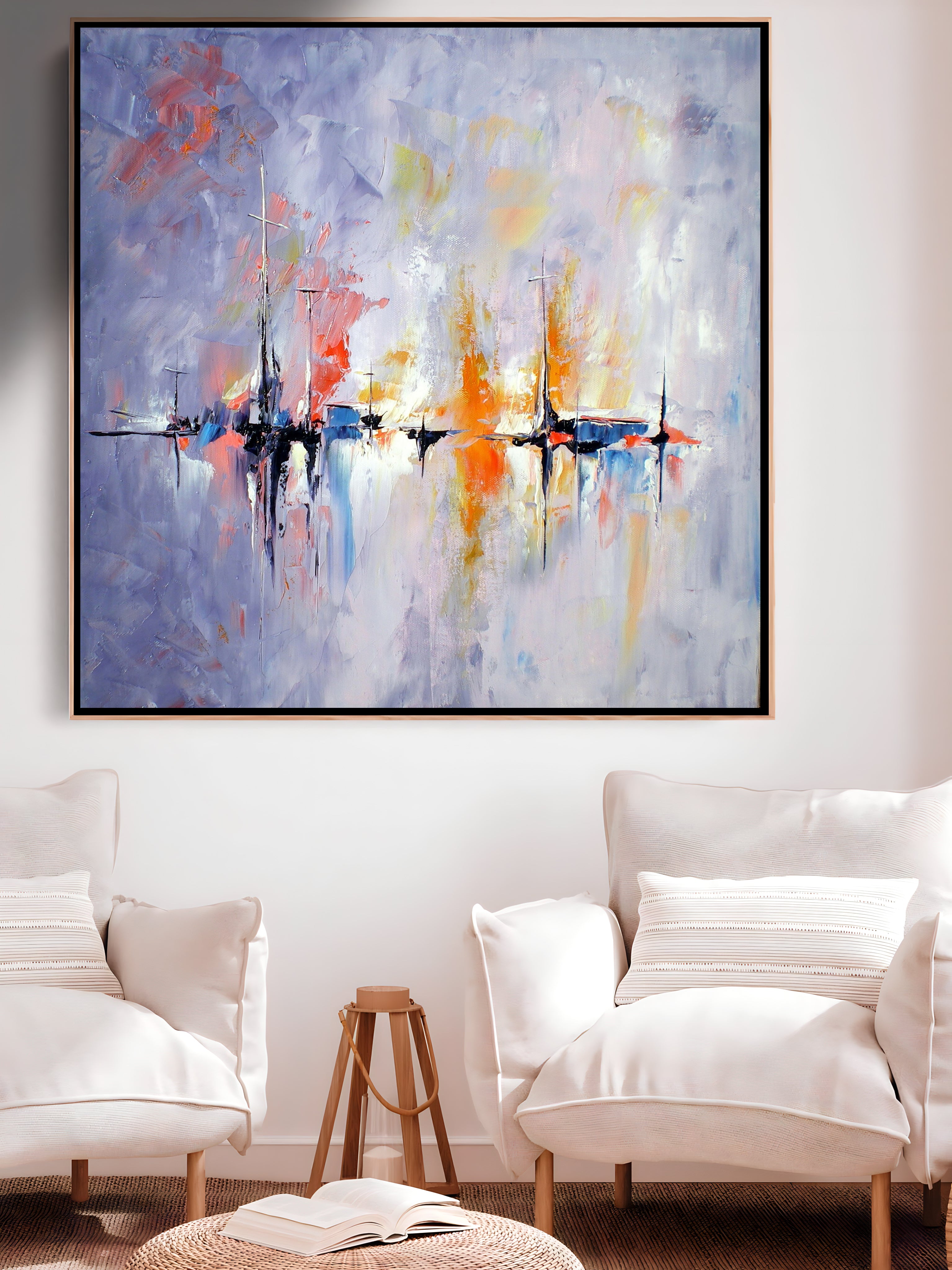 a living room with two white chairs and a large painting on the wall
