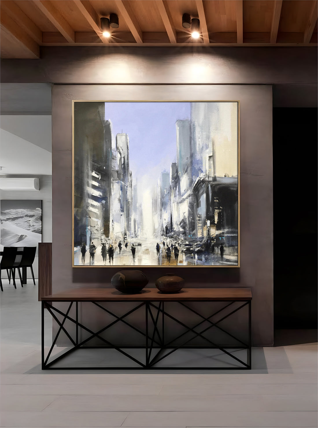 a painting of a cityscape is hanging on a wall