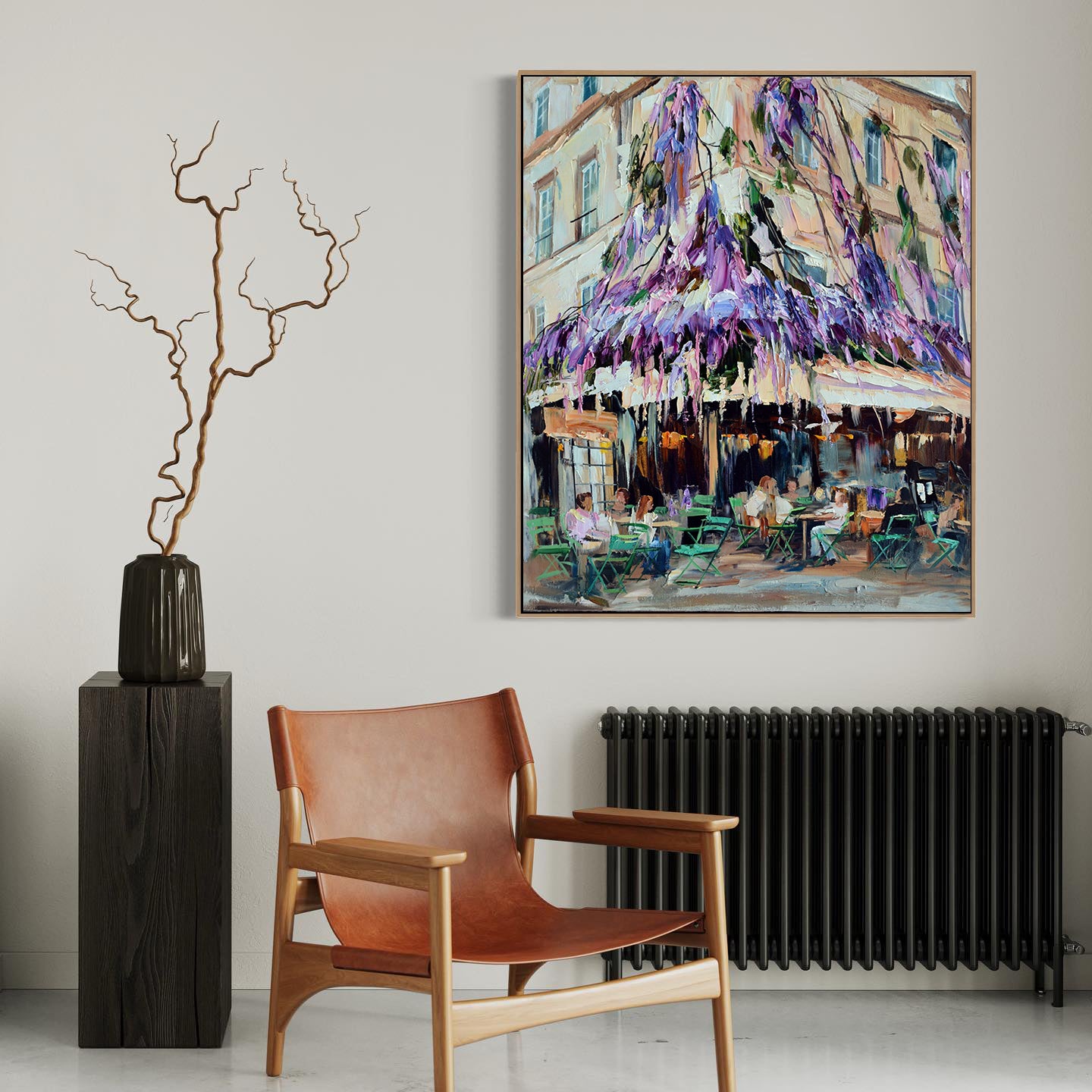 a painting hanging on a wall next to a chair