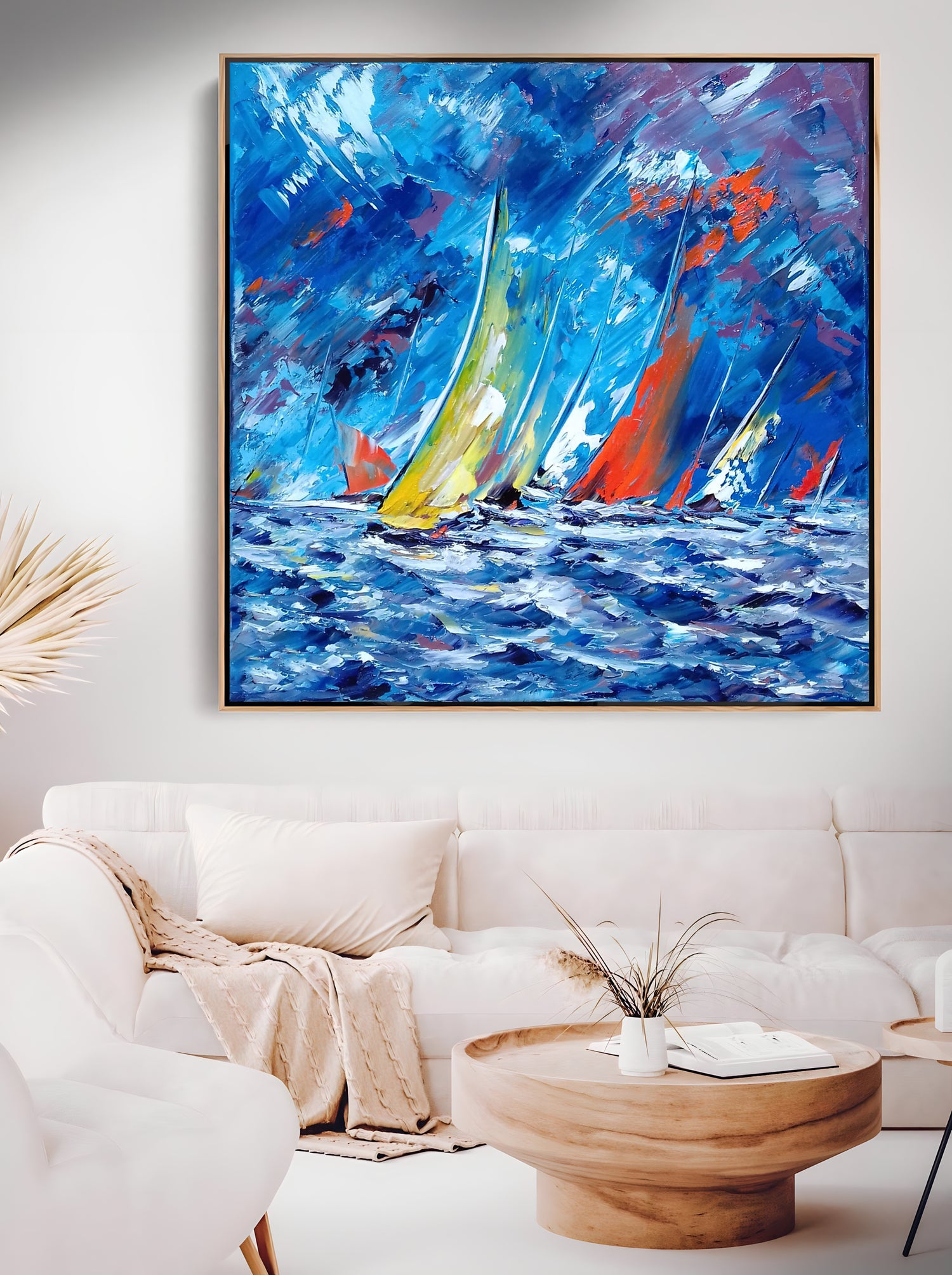 a living room with a painting of sailboats on the water