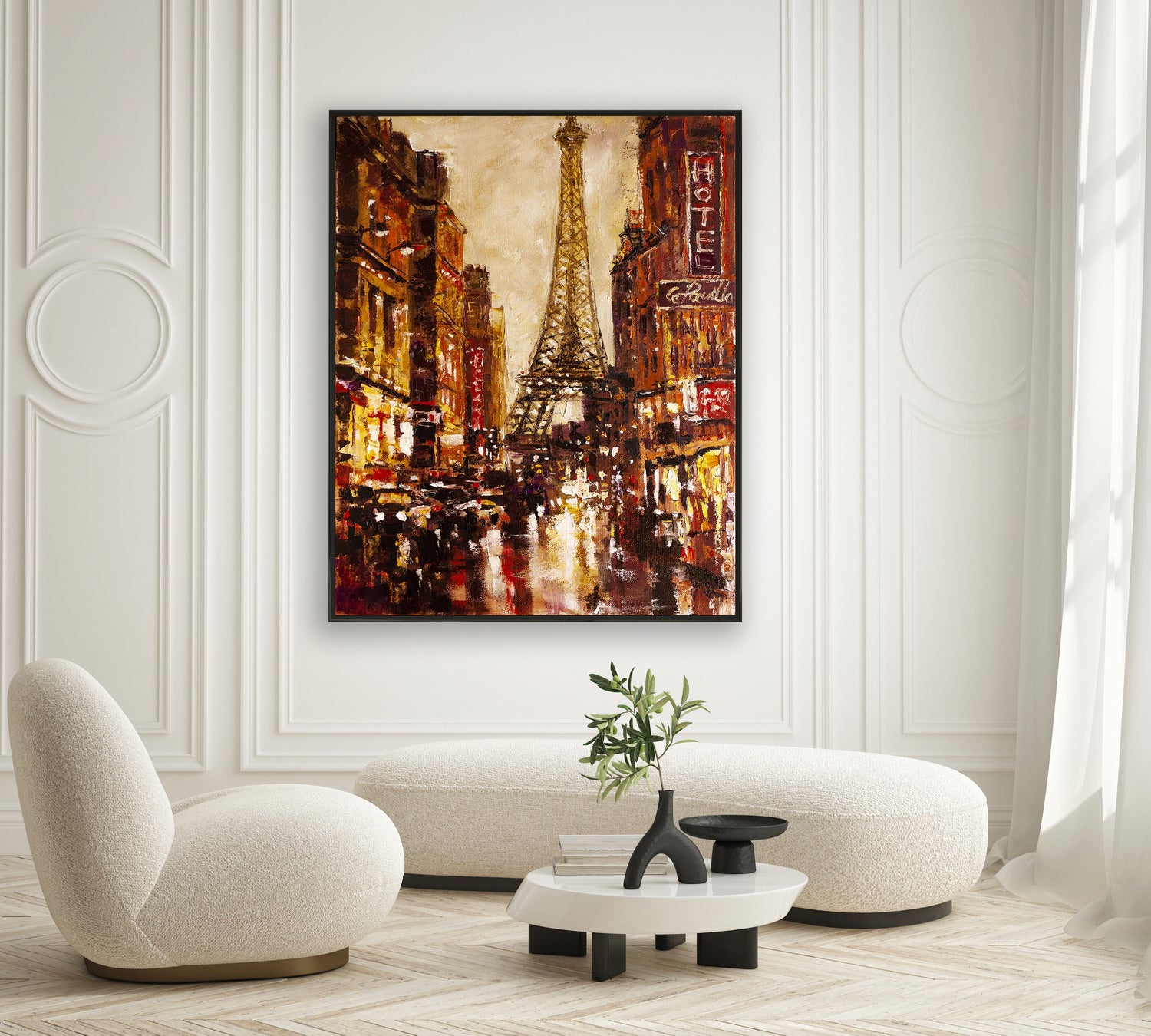 a living room with a painting of the eiffel tower