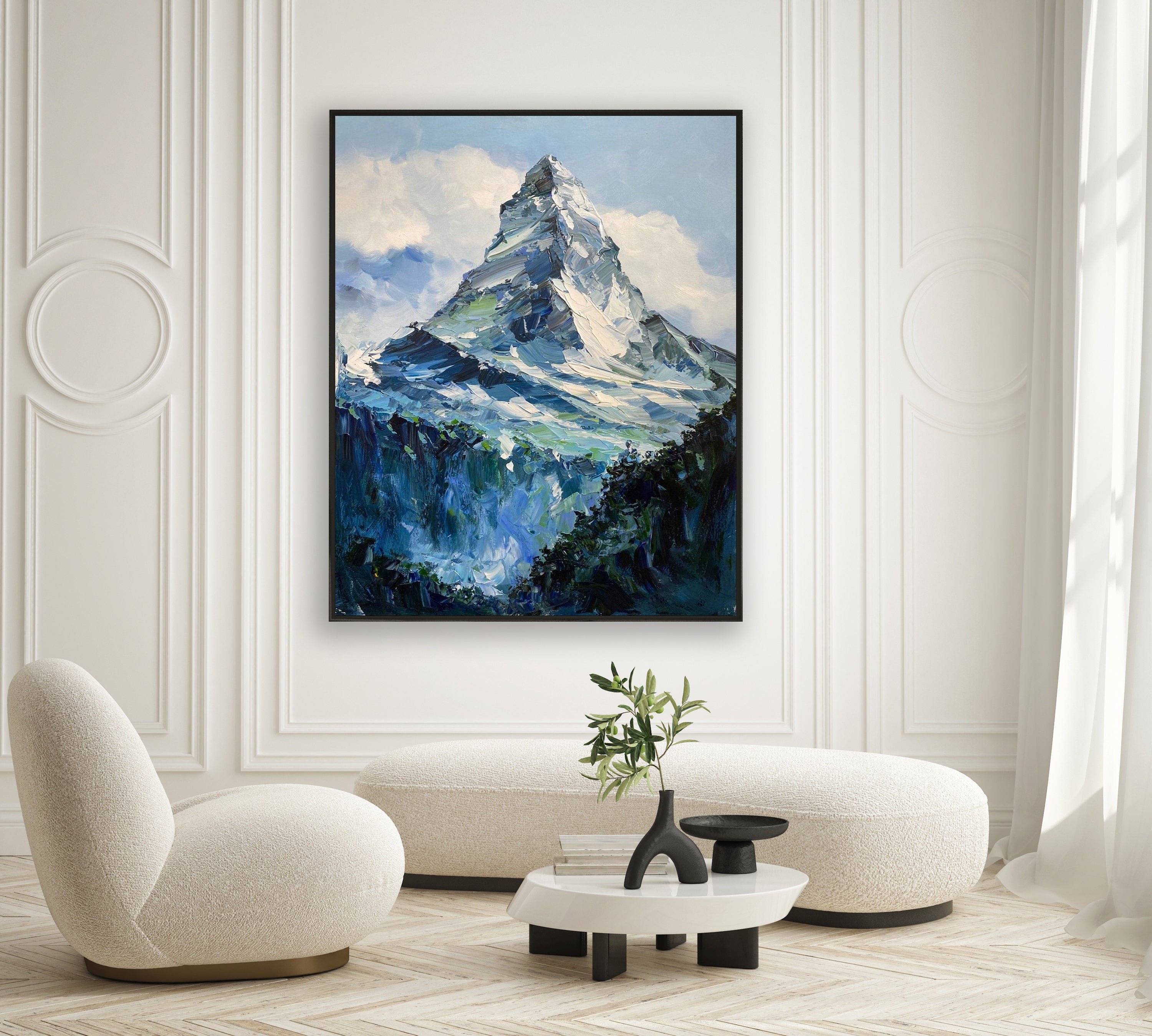 a painting of a mountain in a living room