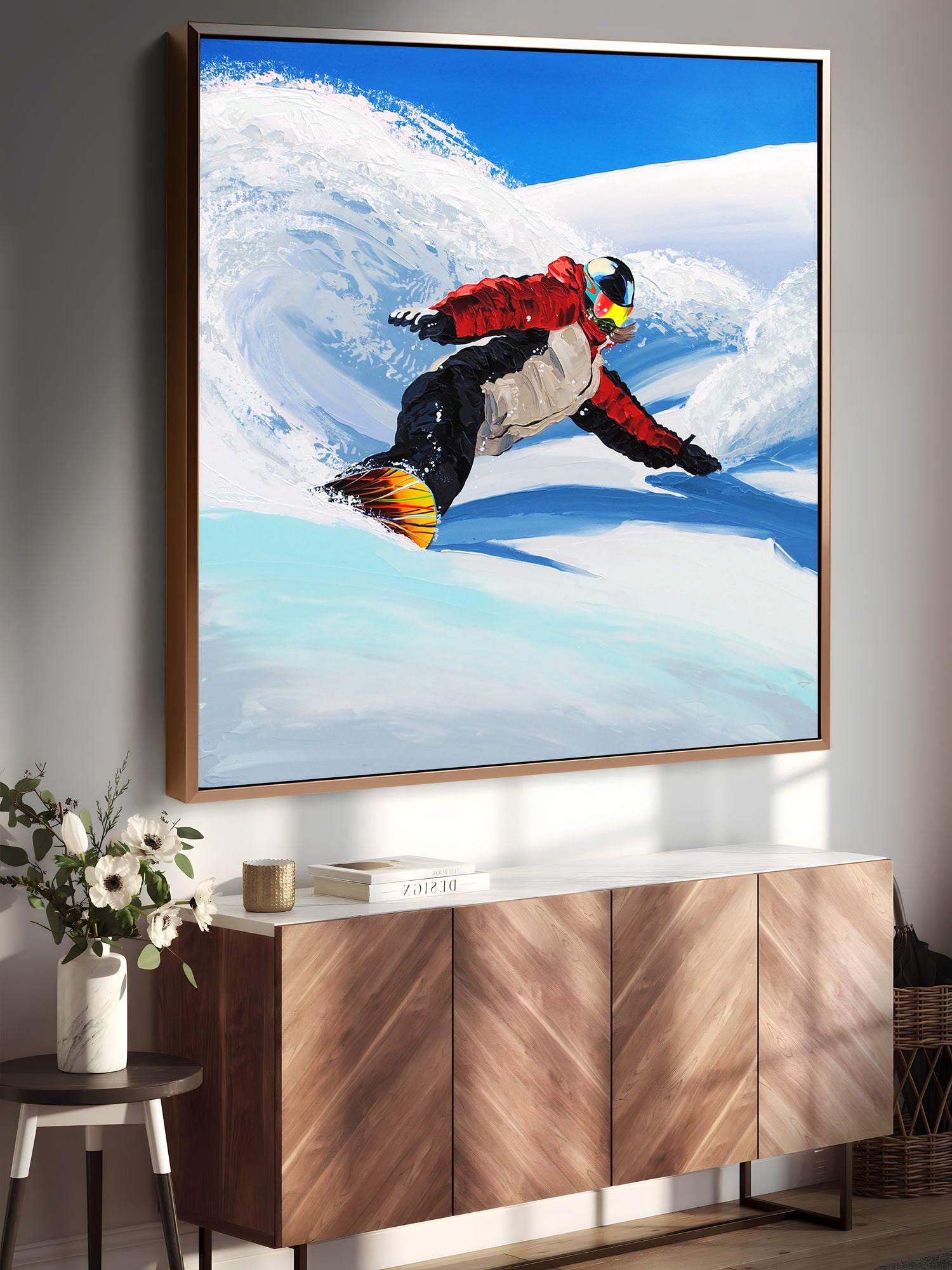 a painting of a snowboarder is hanging on a wall