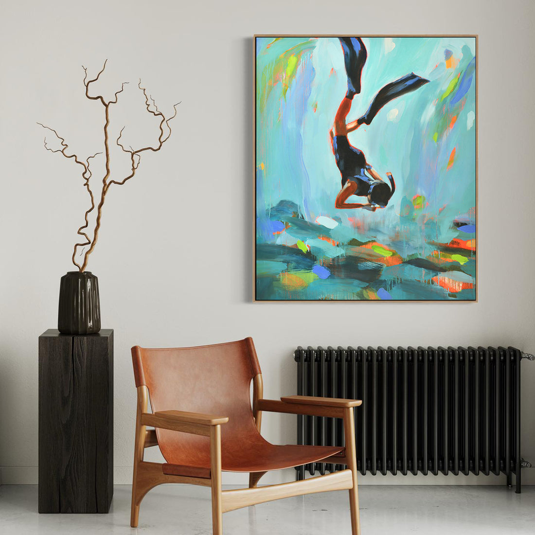 a chair and a painting in a room