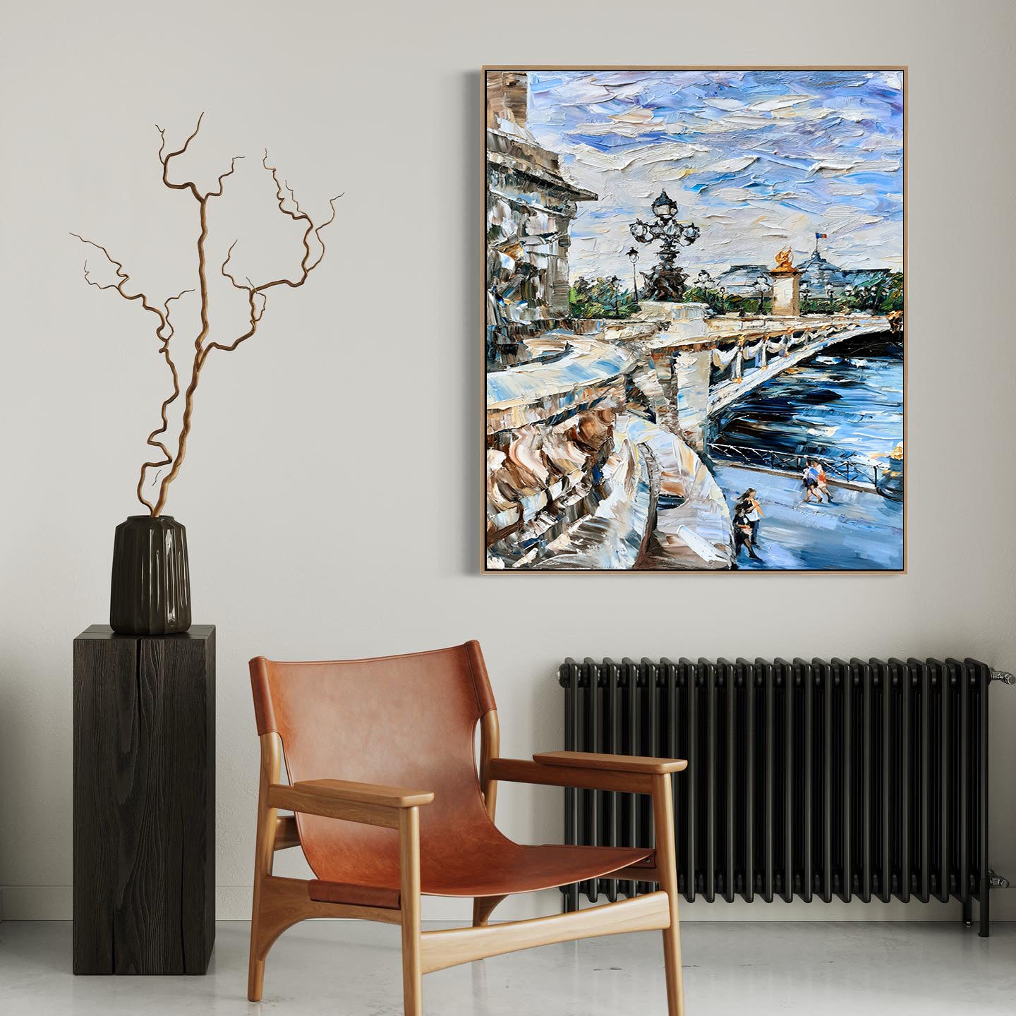 a painting hanging on a wall next to a chair