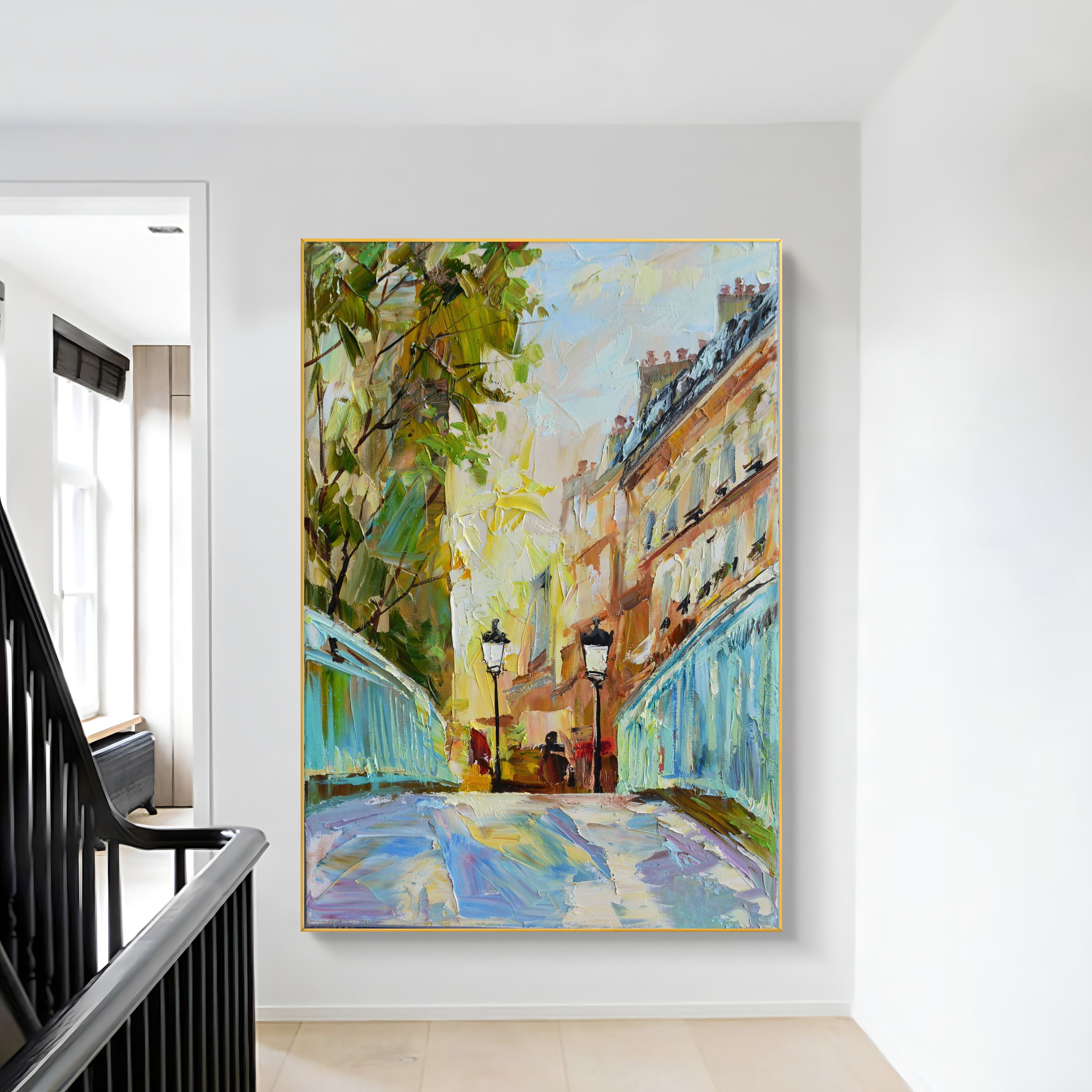 a painting hanging on a wall next to a stair case