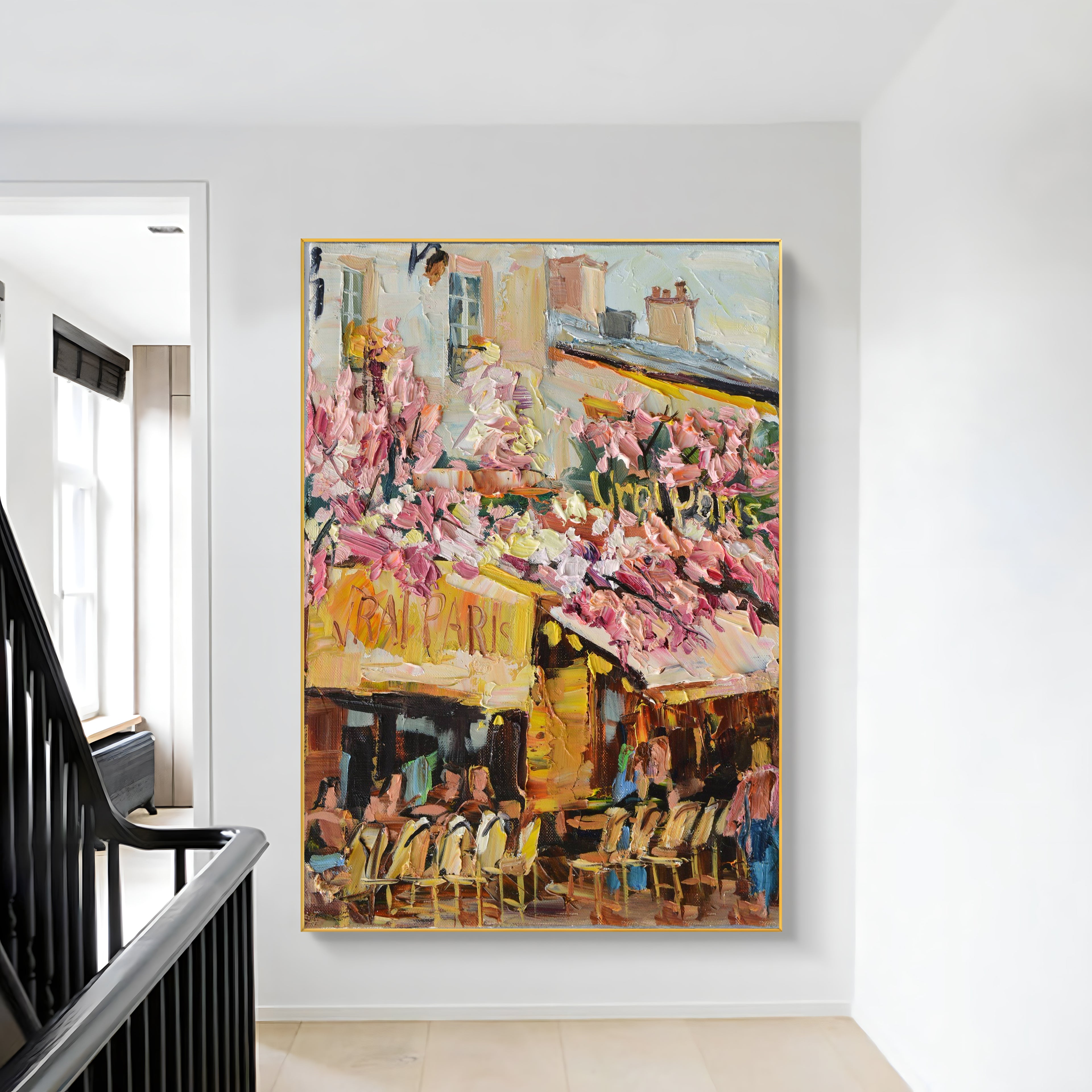 a painting hanging on a wall next to a stair case