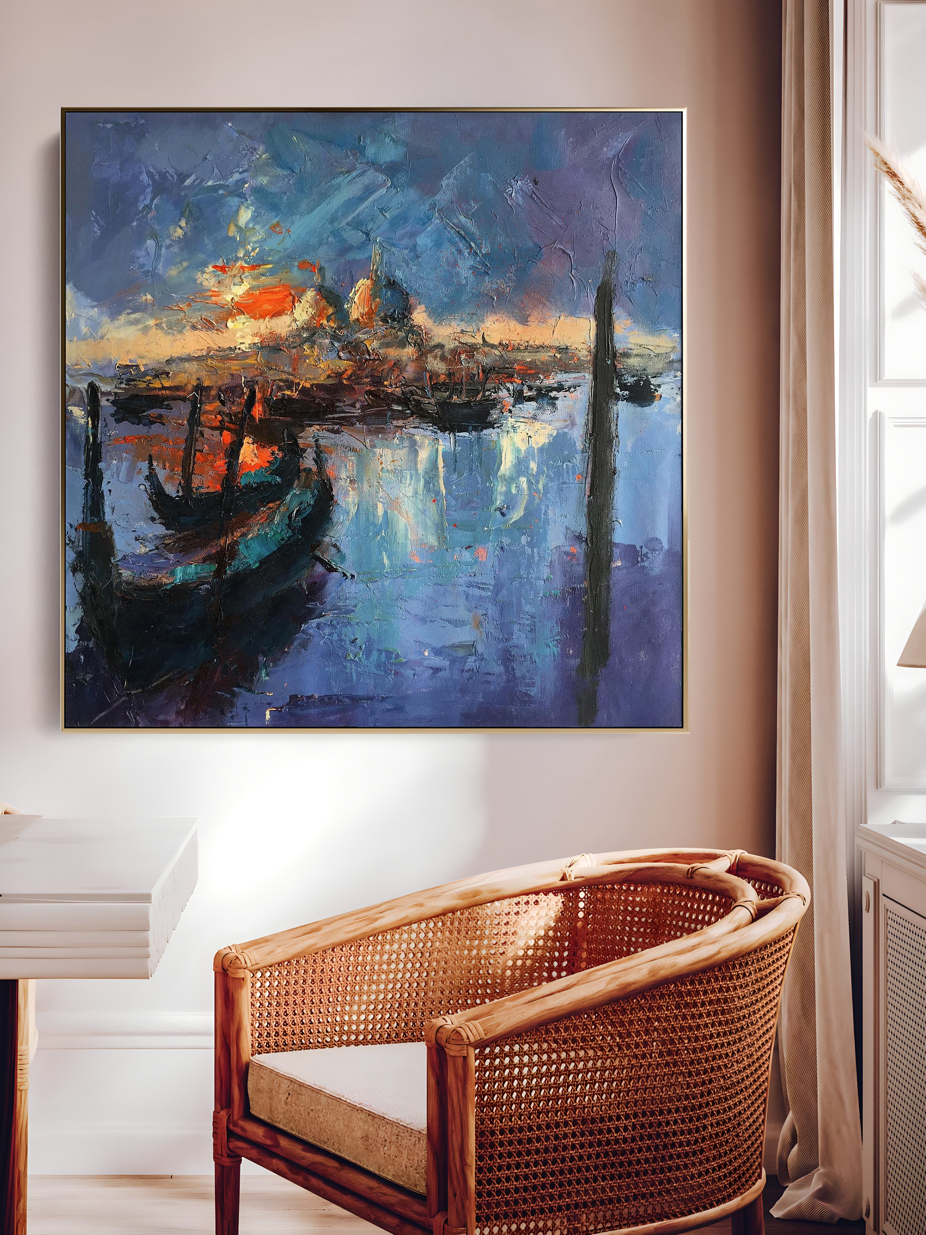 a painting hanging on a wall above a chair