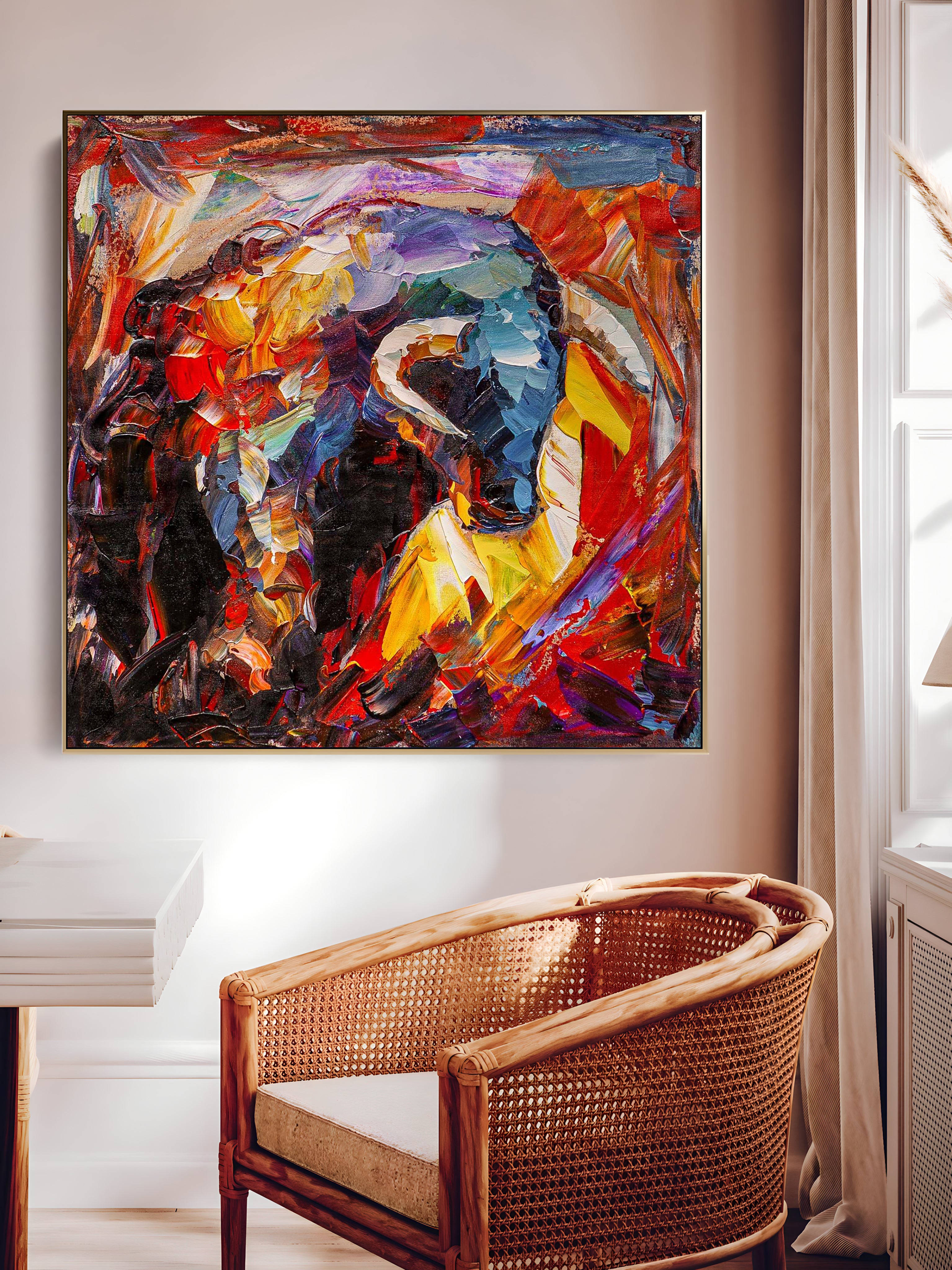 a painting hanging on a wall above a chair