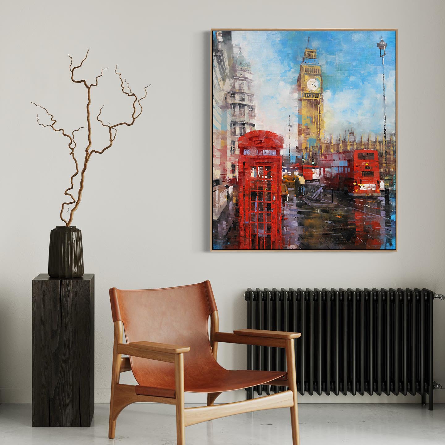 a living room with a chair and a painting on the wall