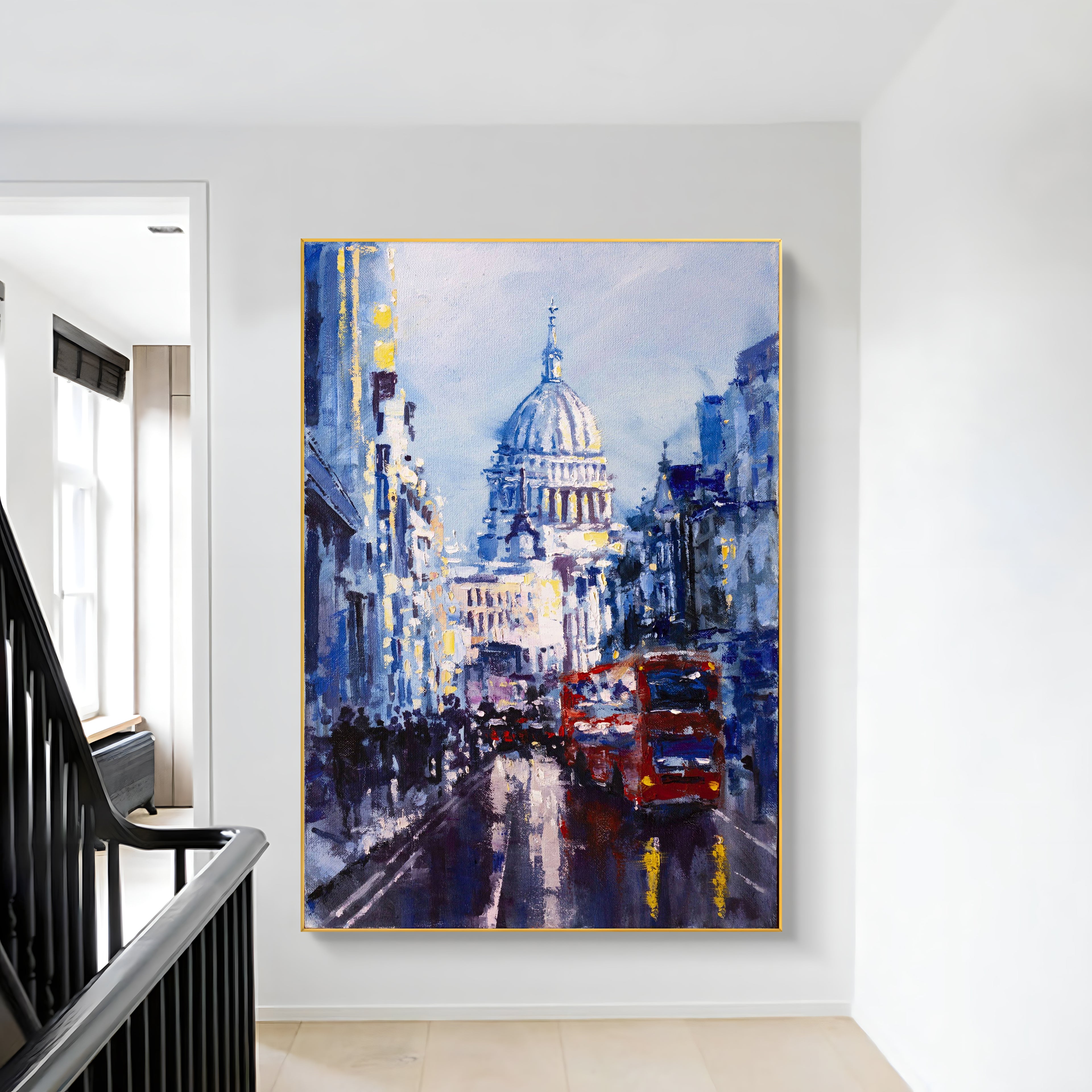 a painting hanging on a wall next to a stair case