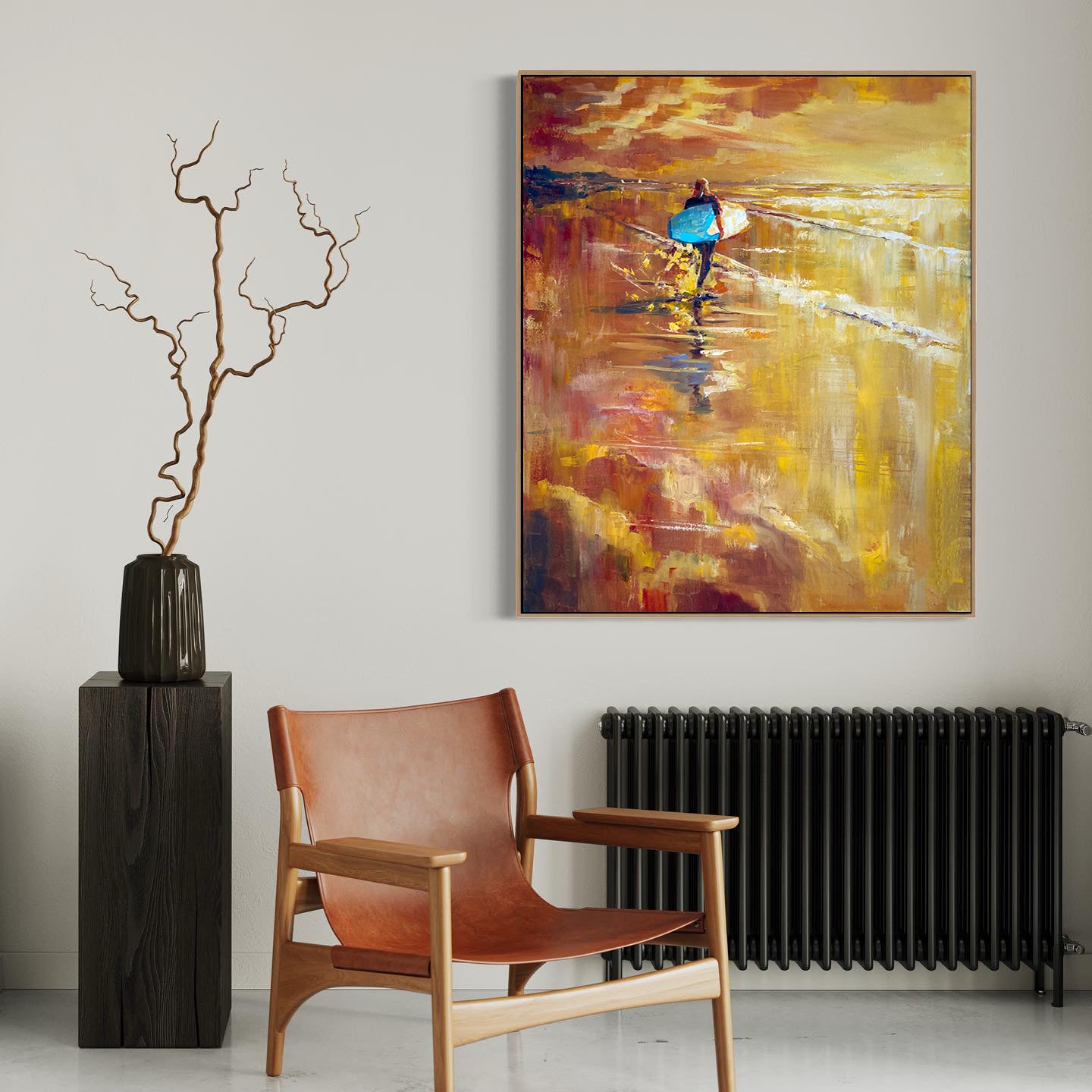 a painting on a wall next to a chair and a vase