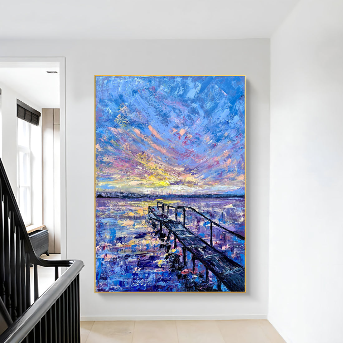 a painting hanging on a wall next to a stair case