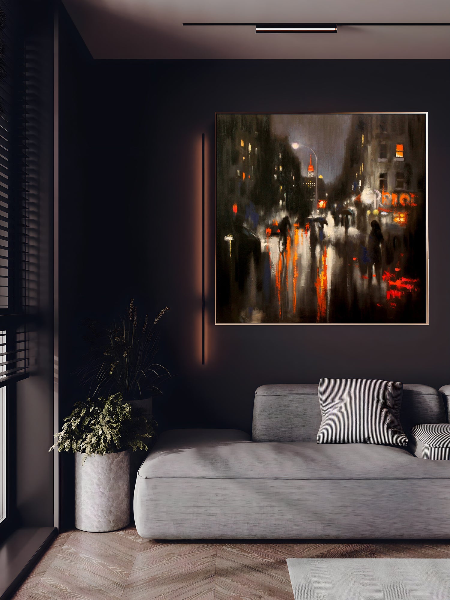 a living room with a couch and a painting on the wall