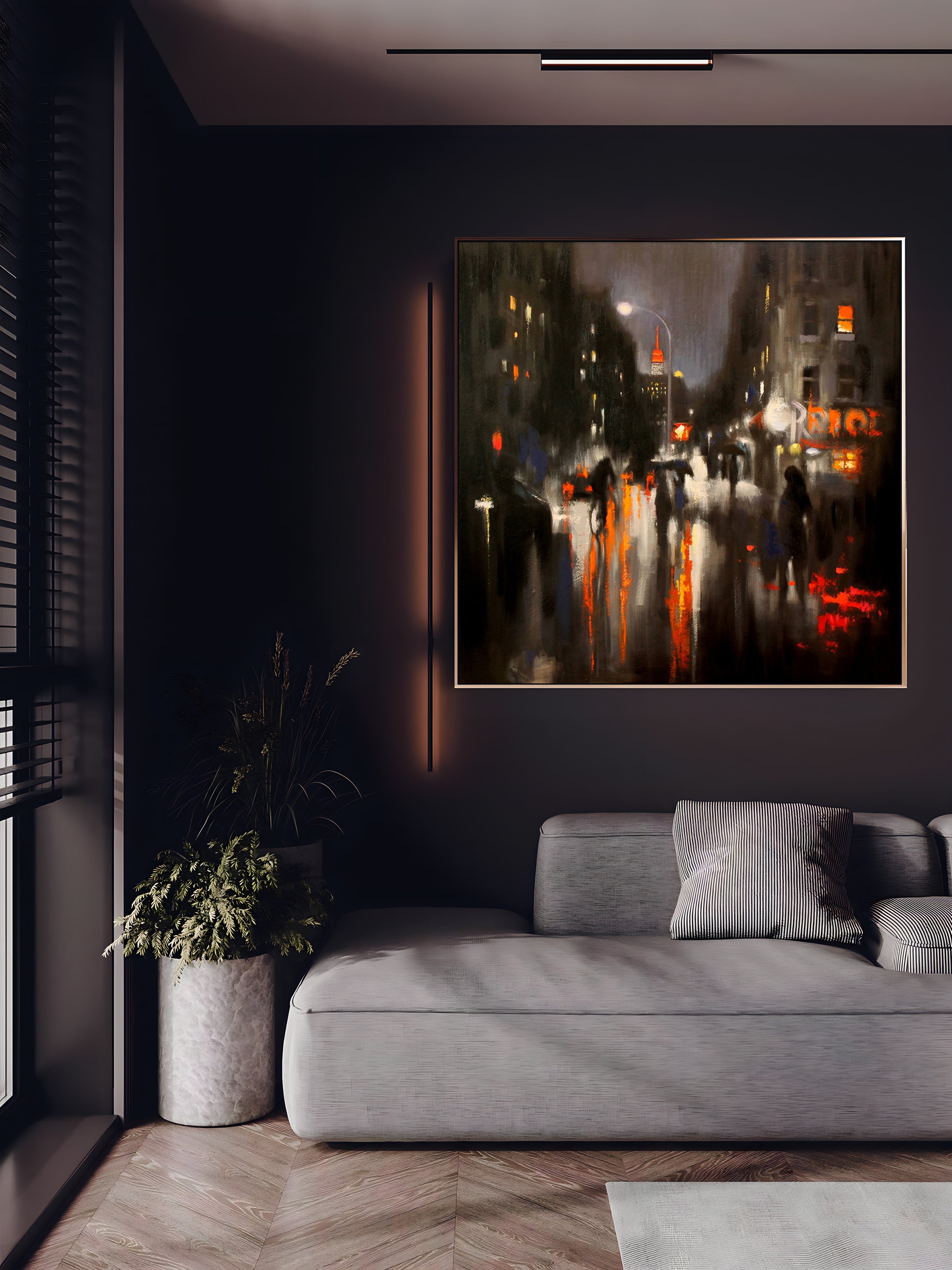 a living room with a couch and a painting on the wall