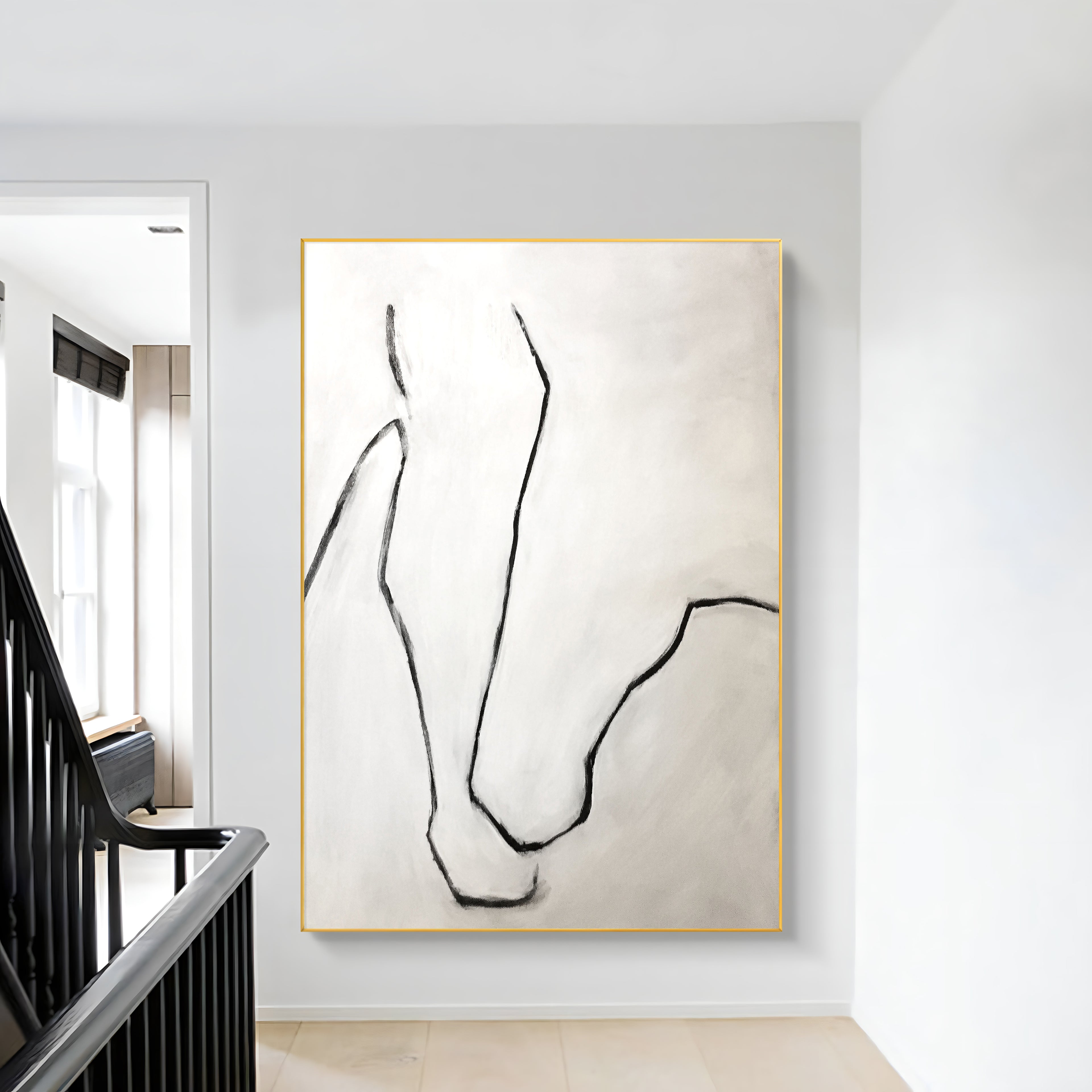 a painting hanging on a wall next to a staircase