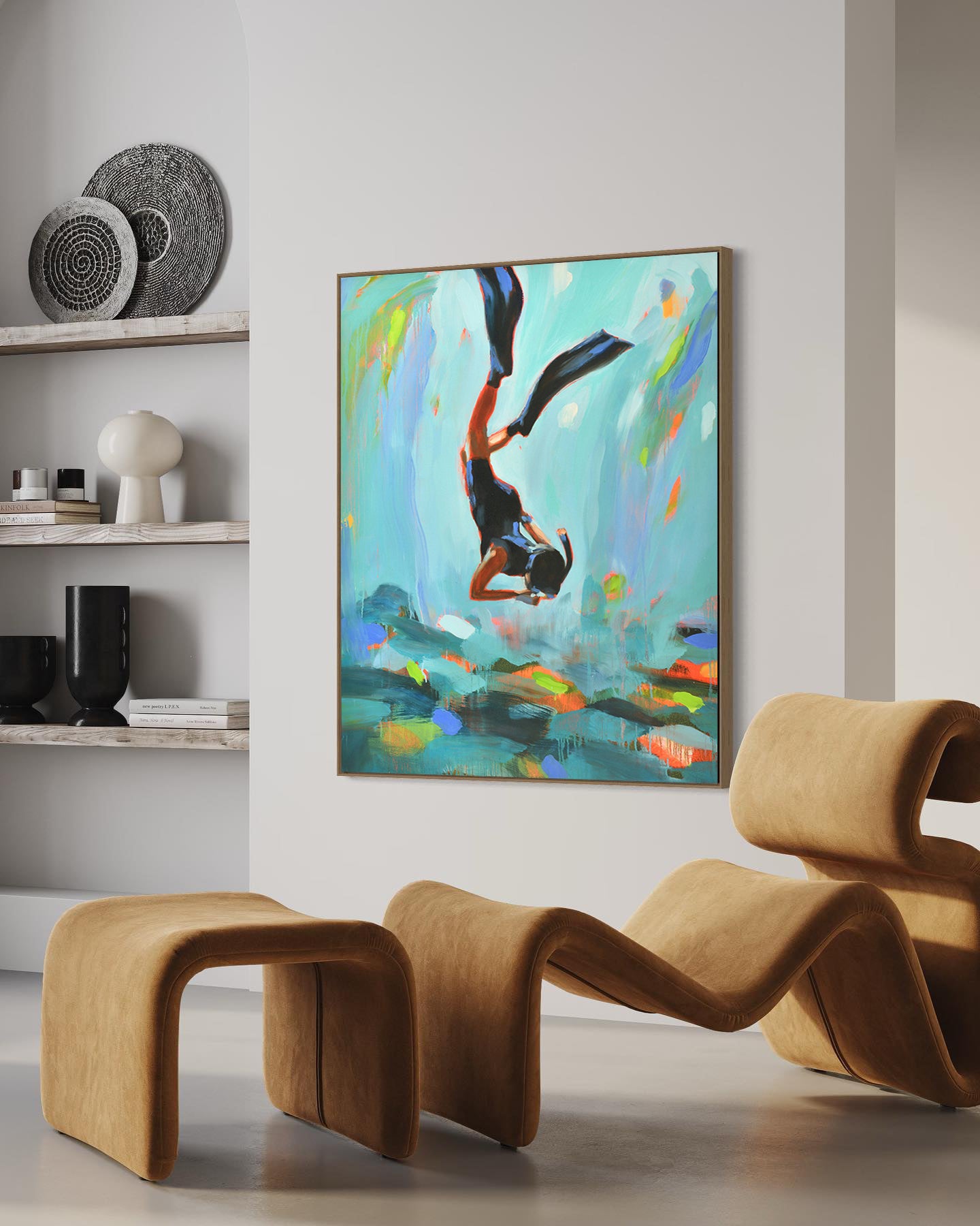 a painting hanging on a wall next to a chair