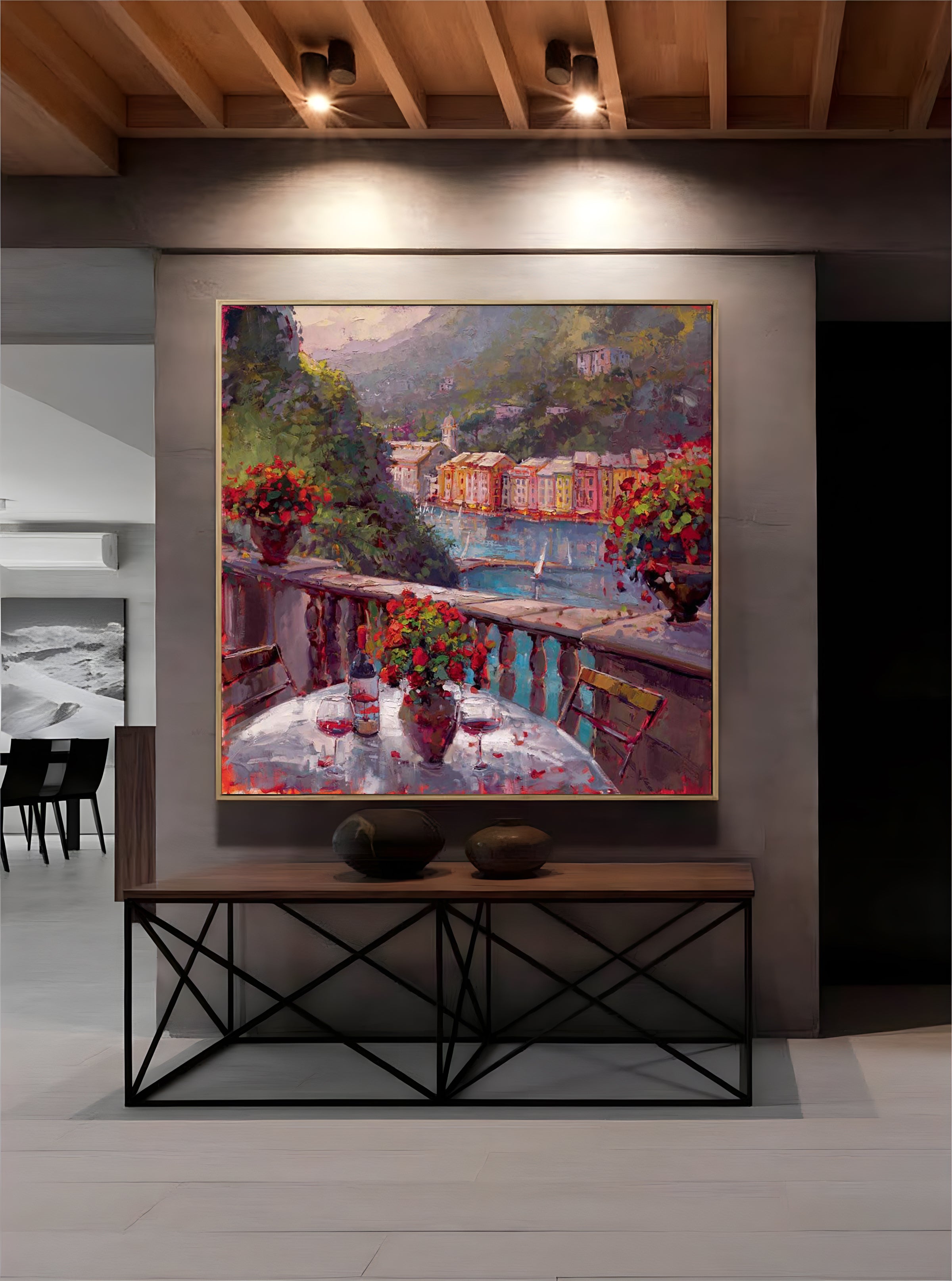 a painting hanging on a wall above a table