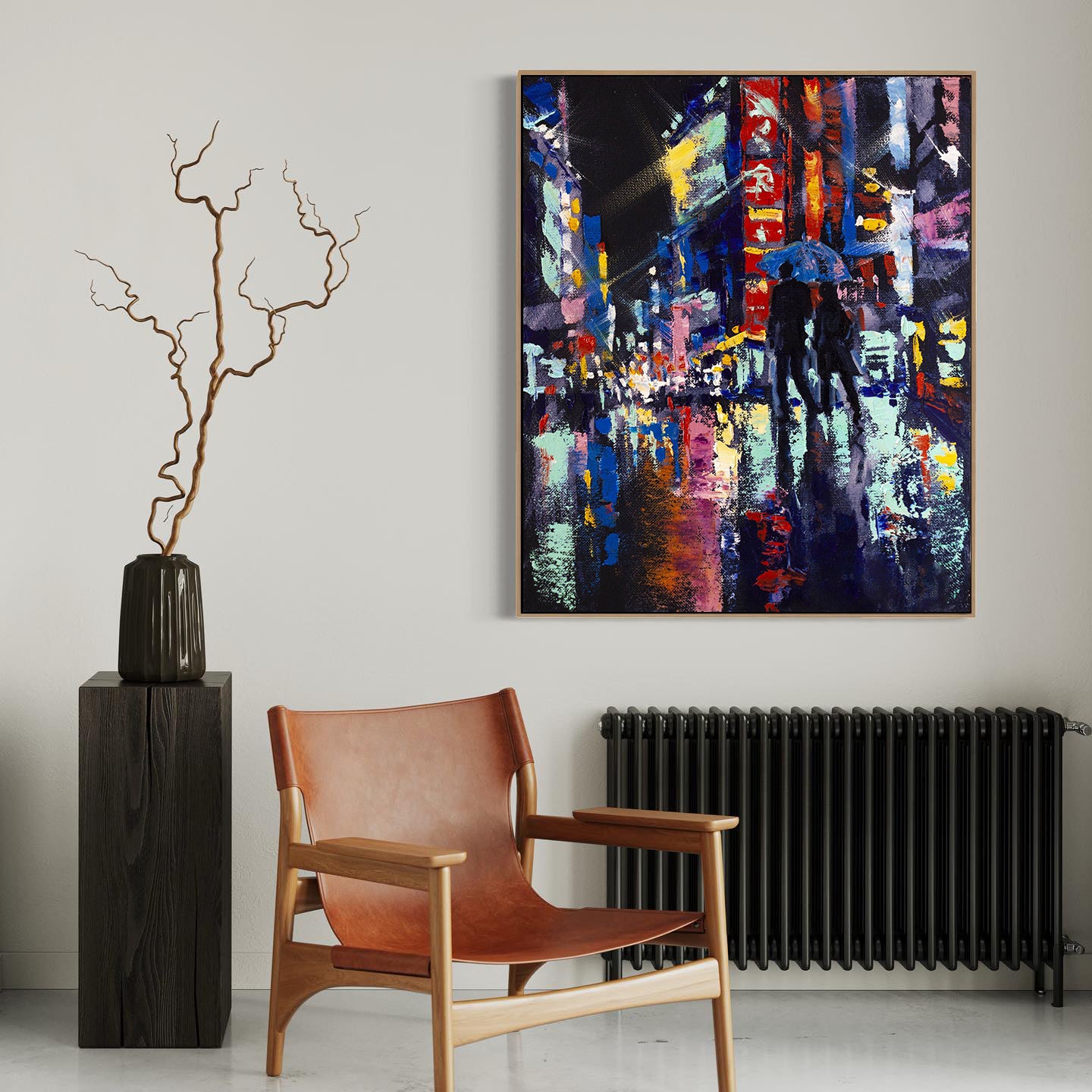 a painting on a wall above a chair and a radiator