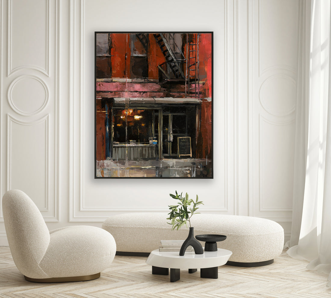 a living room with white furniture and a painting on the wall