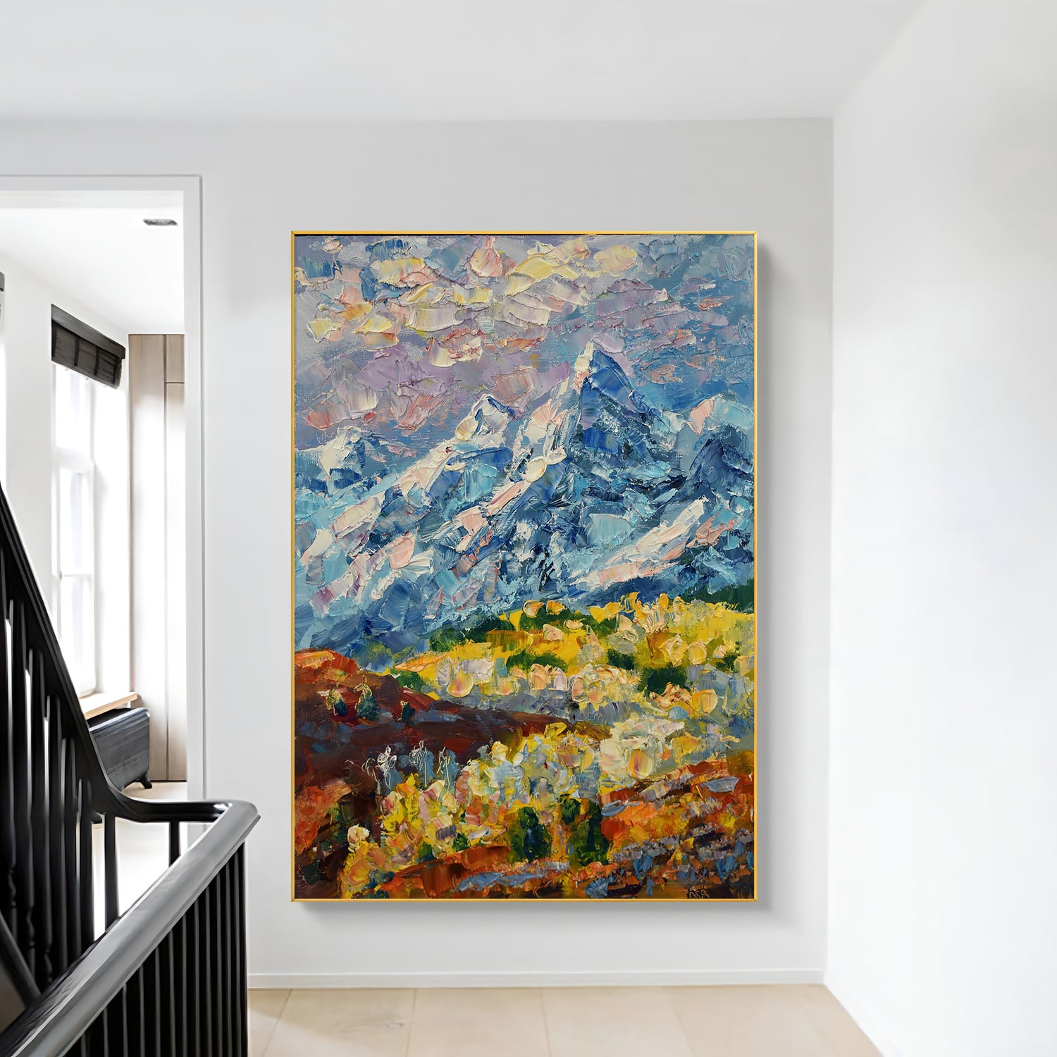 a painting hanging on a wall next to a stair case