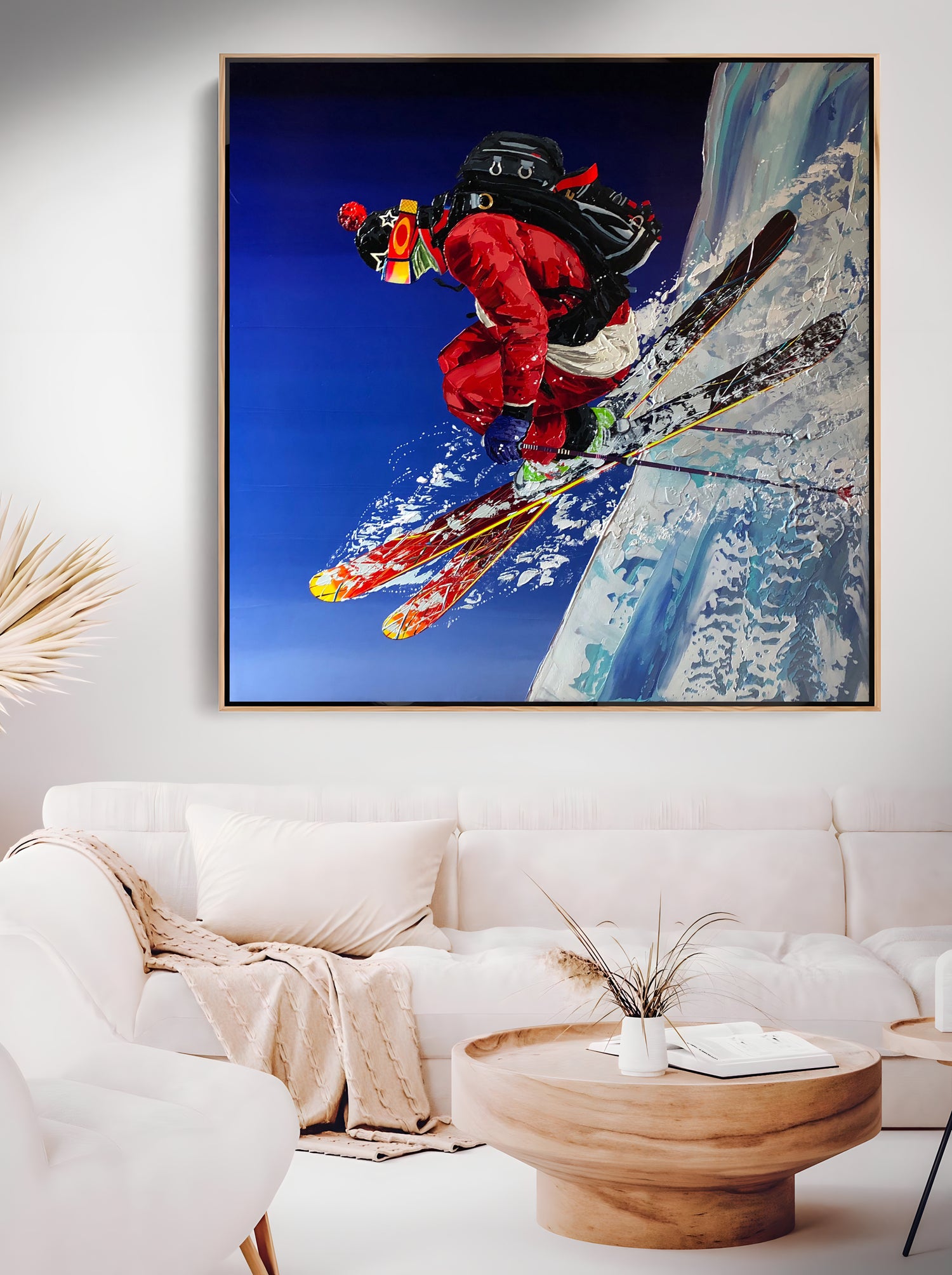 a painting of a skier is hanging in a living room