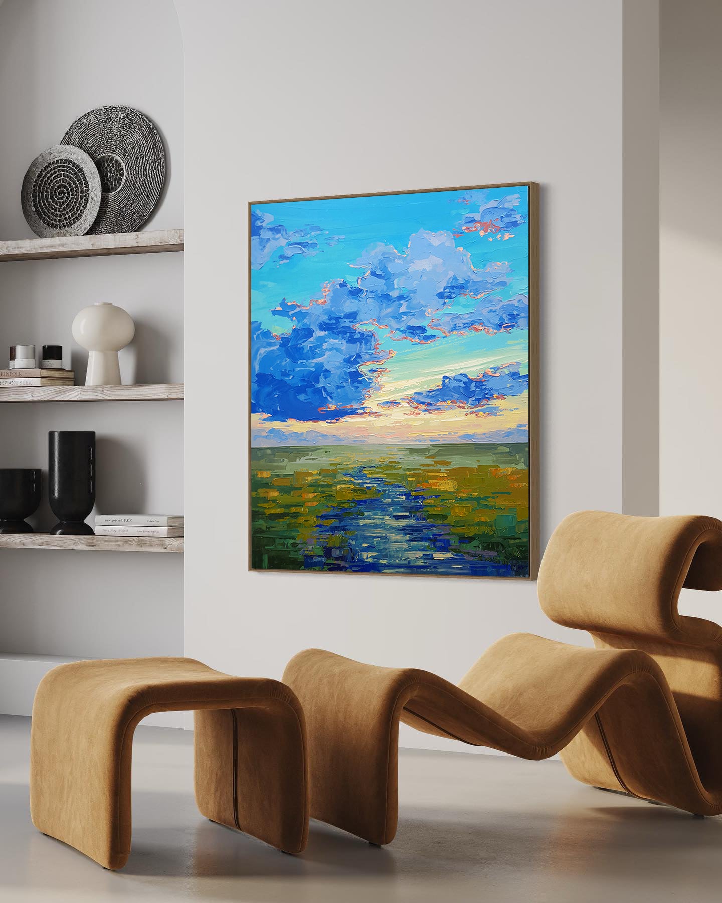 a painting hanging on a wall next to two chairs