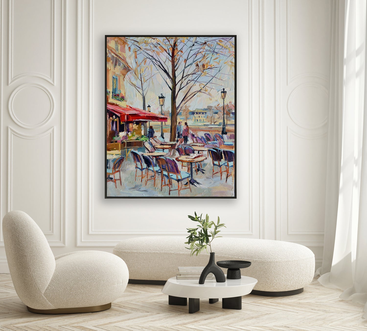 a living room with a painting on the wall