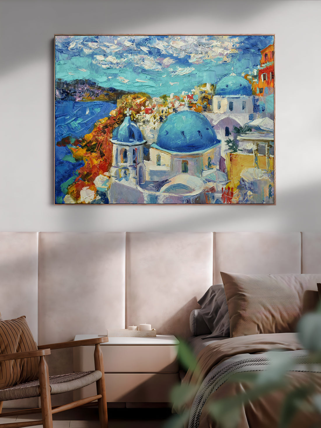 a painting hanging on a wall above a bed