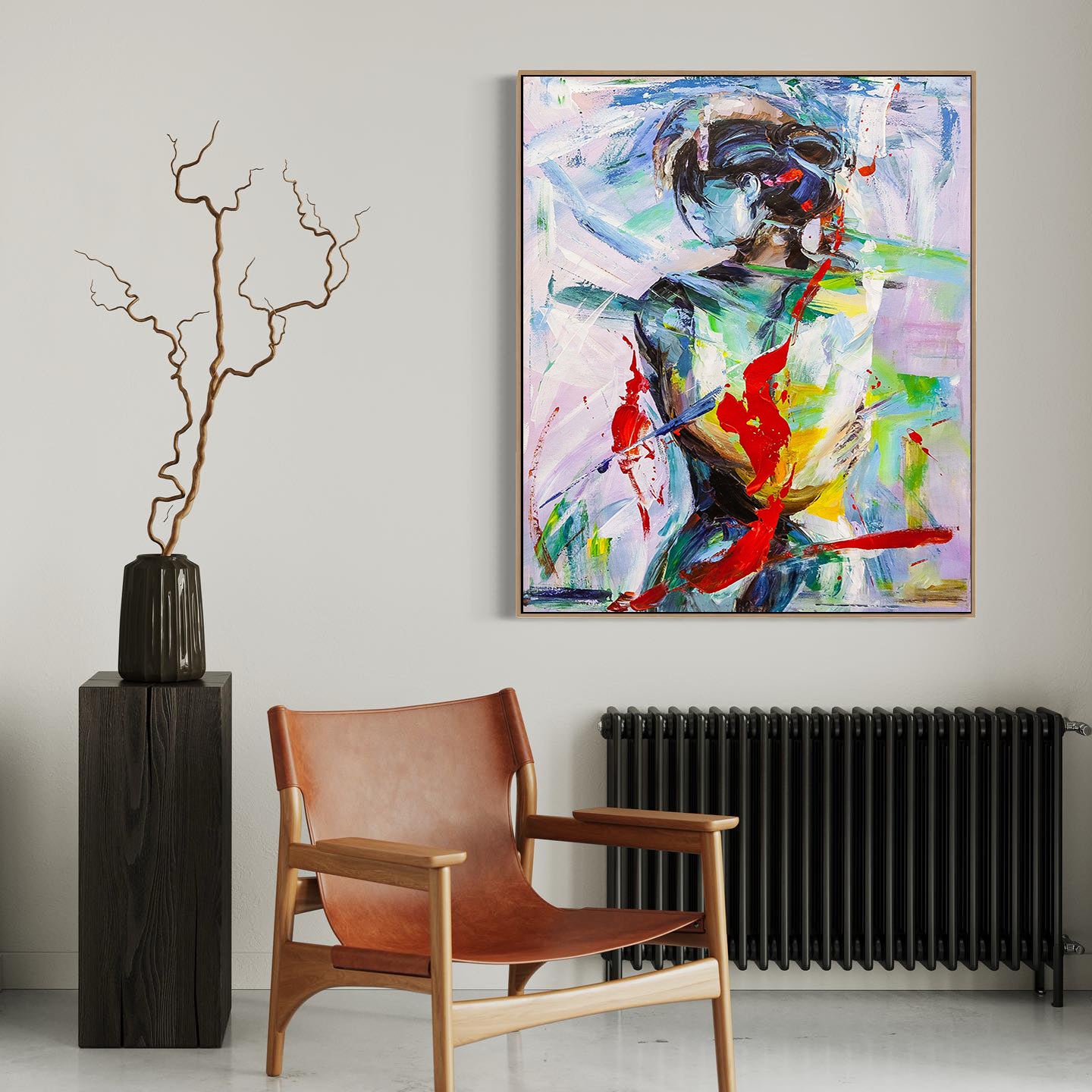 a painting on a wall next to a chair and a vase