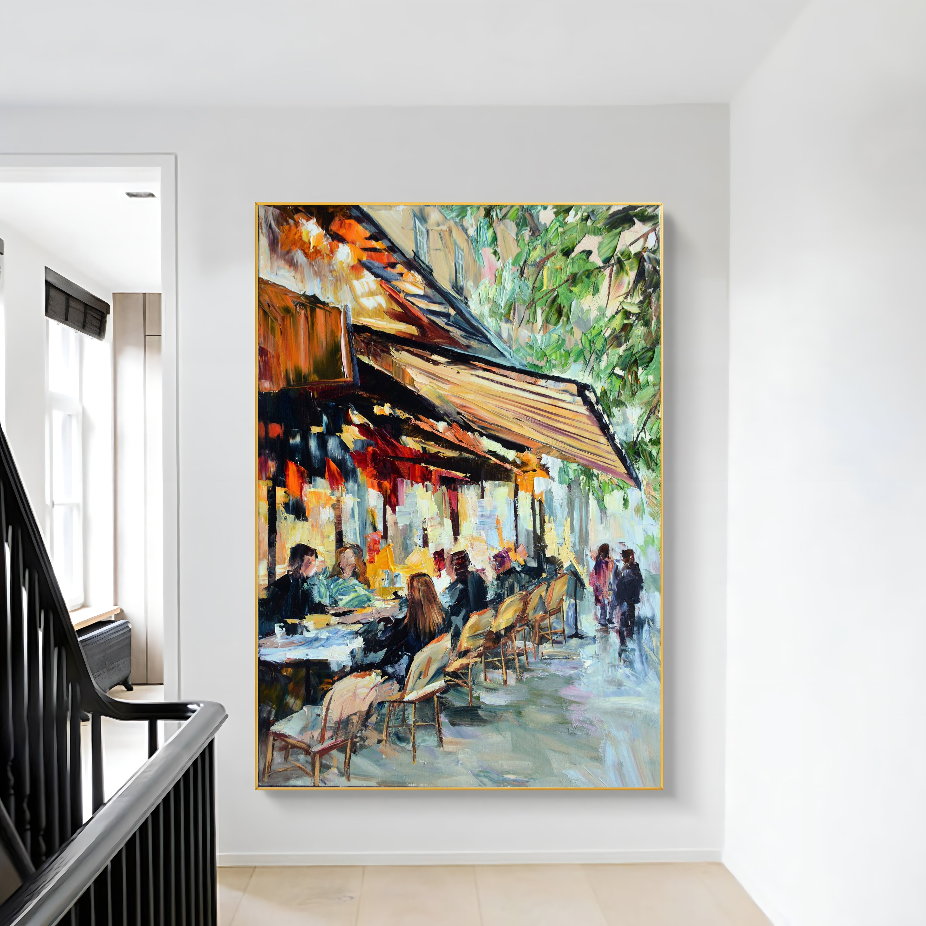 a painting hanging on a wall next to a staircase