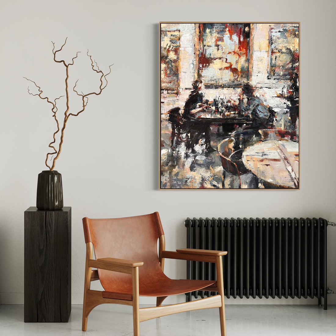 a painting hanging on a wall next to a chair