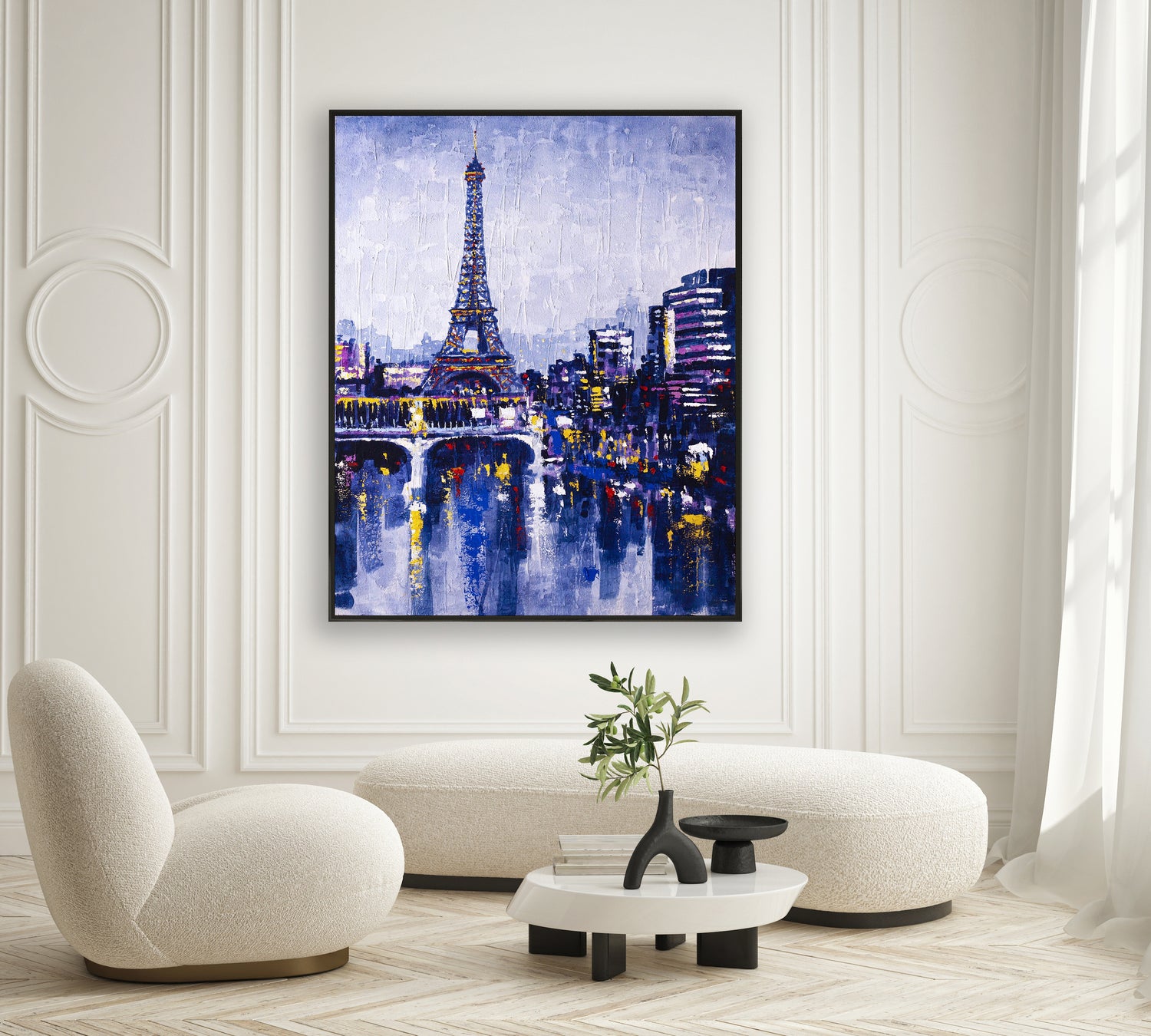 a living room with a painting of the eiffel tower