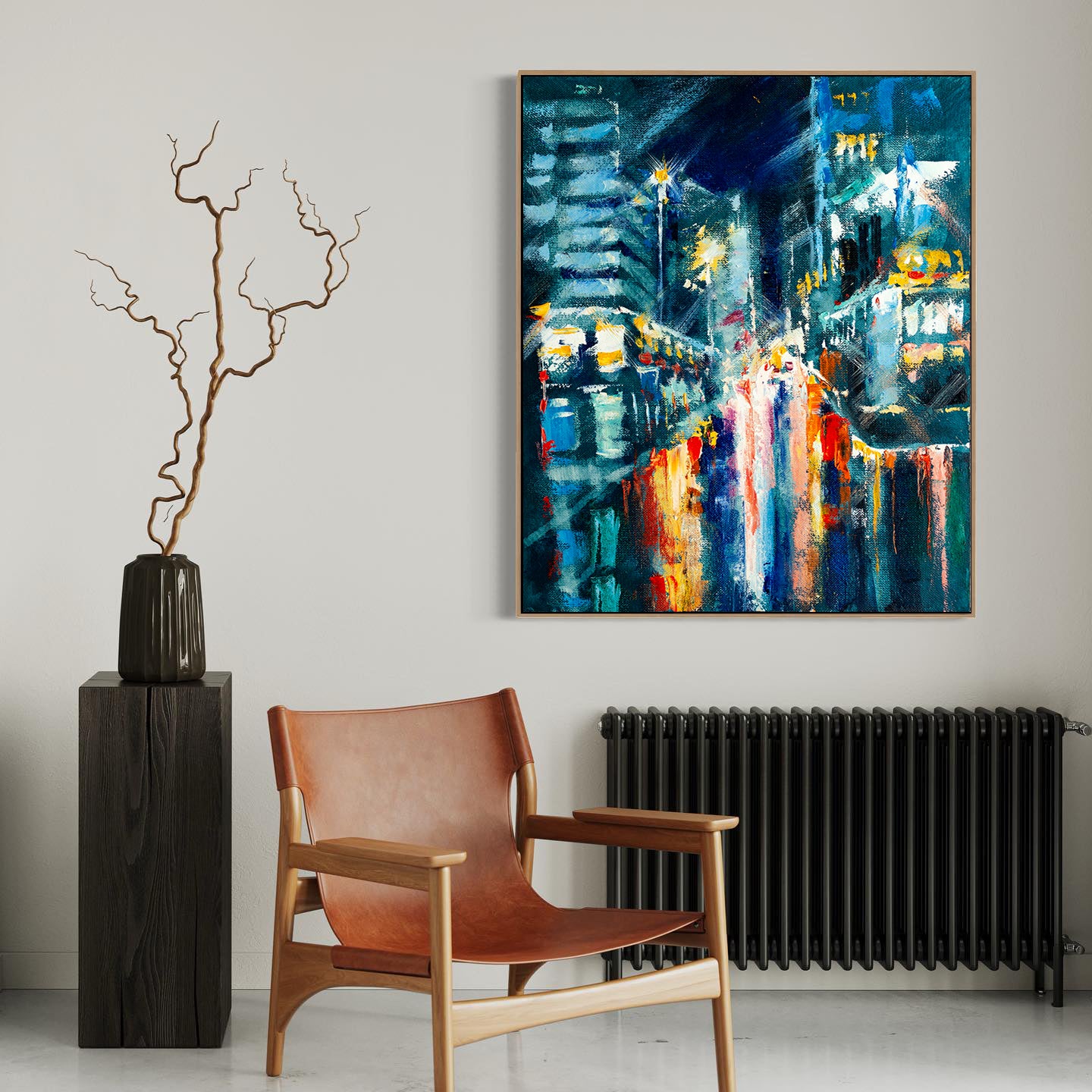 a painting hanging on a wall next to a chair