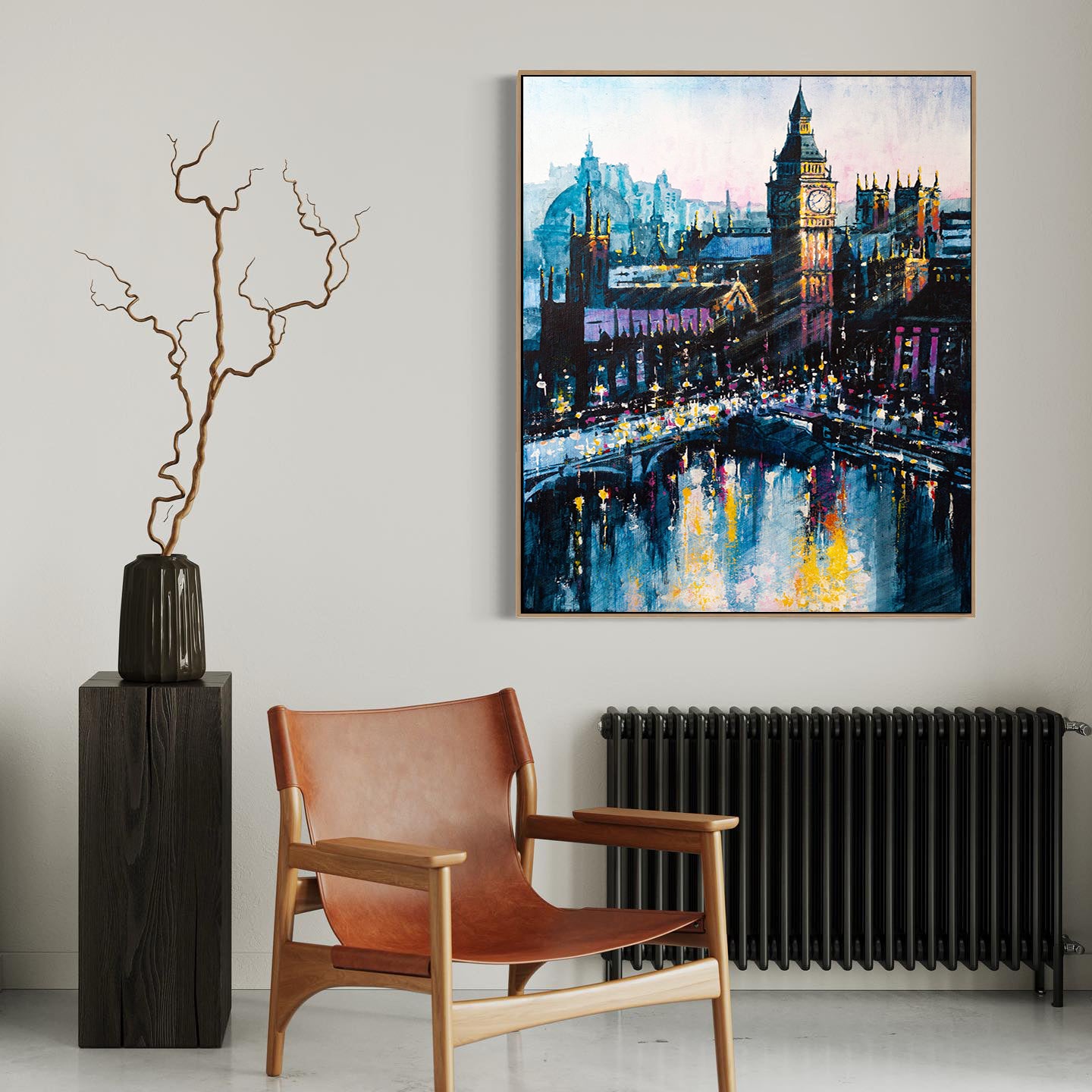 a painting hanging on a wall next to a chair