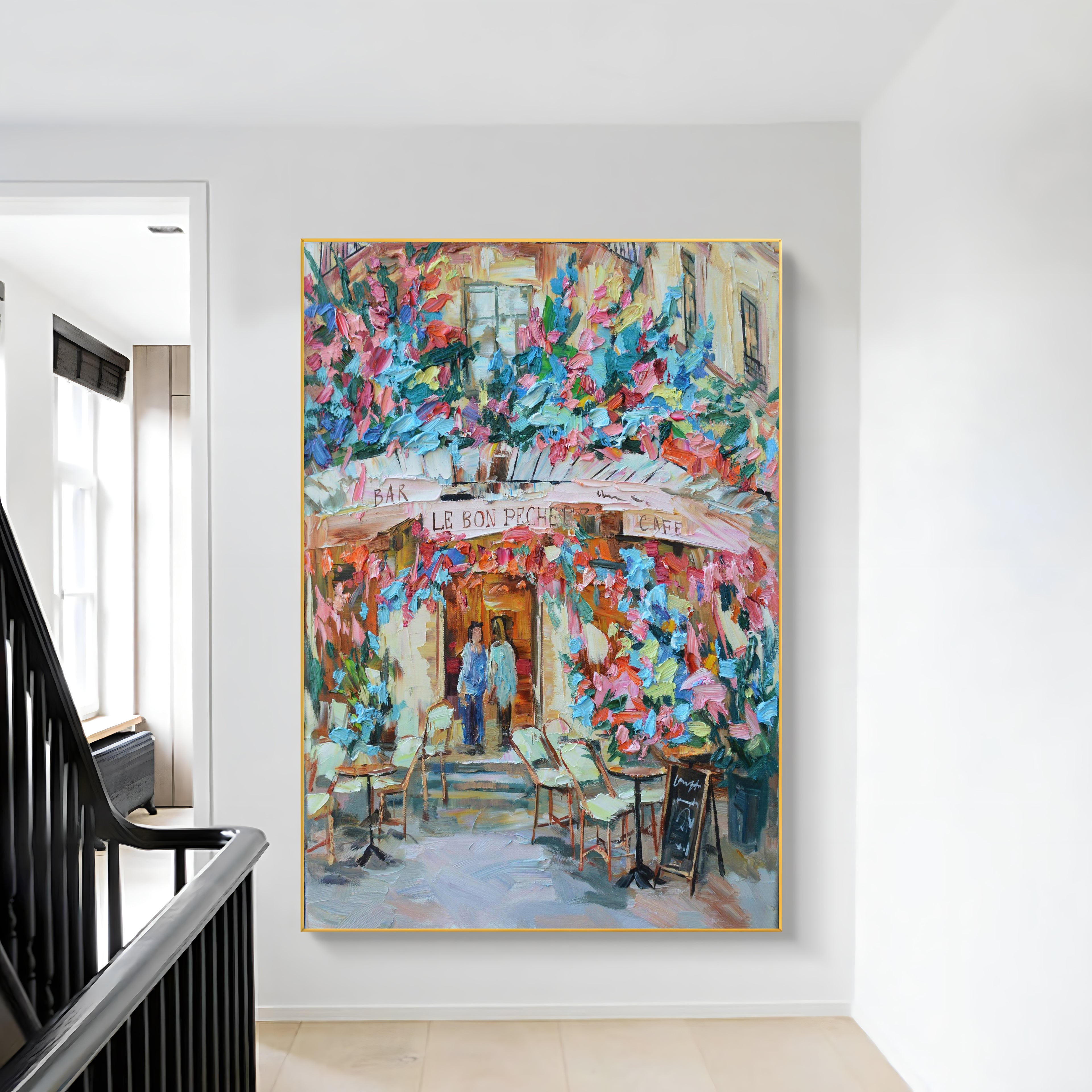 a painting hanging on a wall next to a stair case