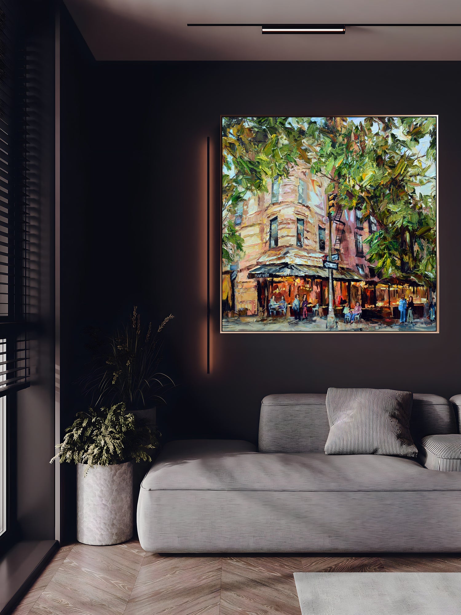 a living room with a couch and a painting on the wall