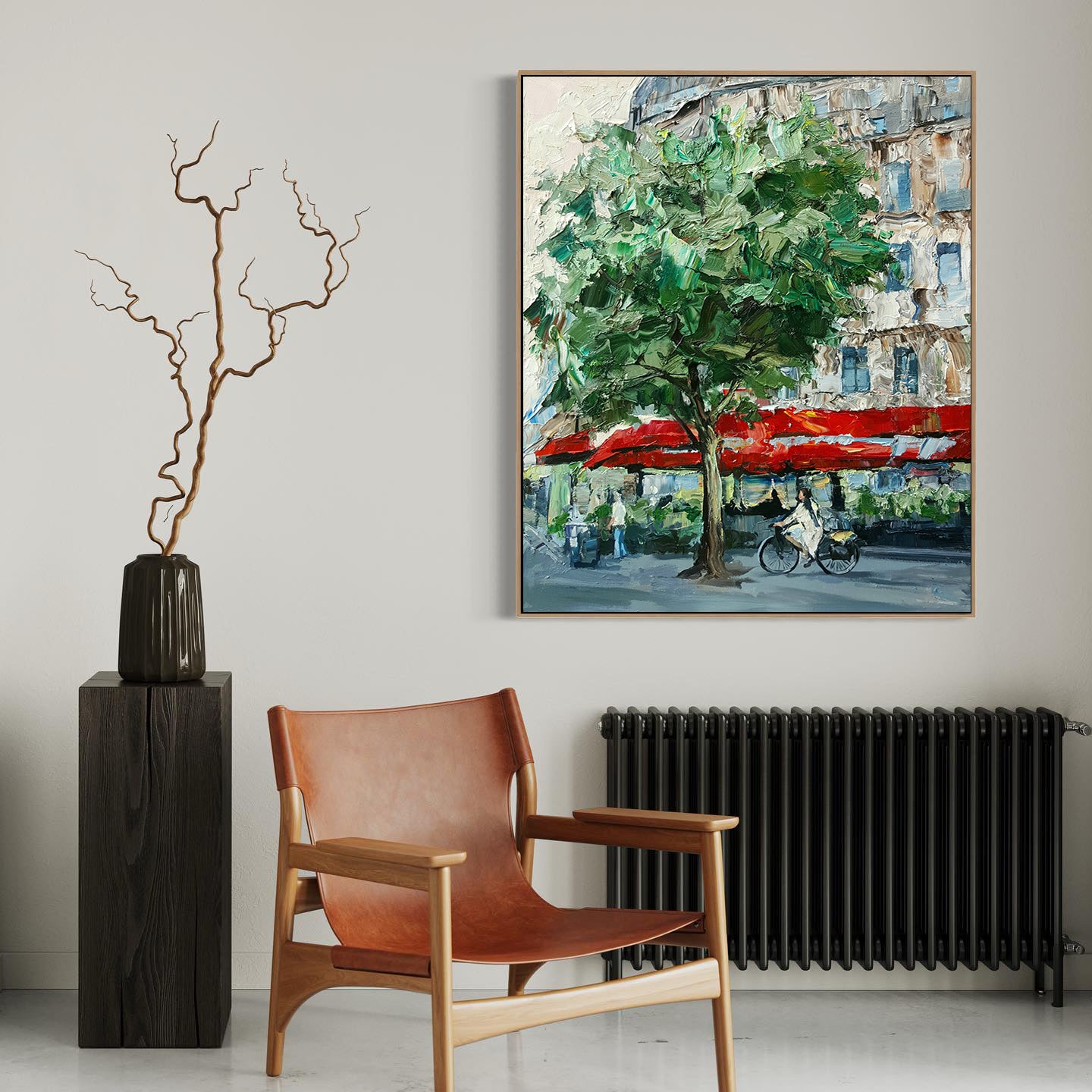 a painting hanging on a wall next to a chair