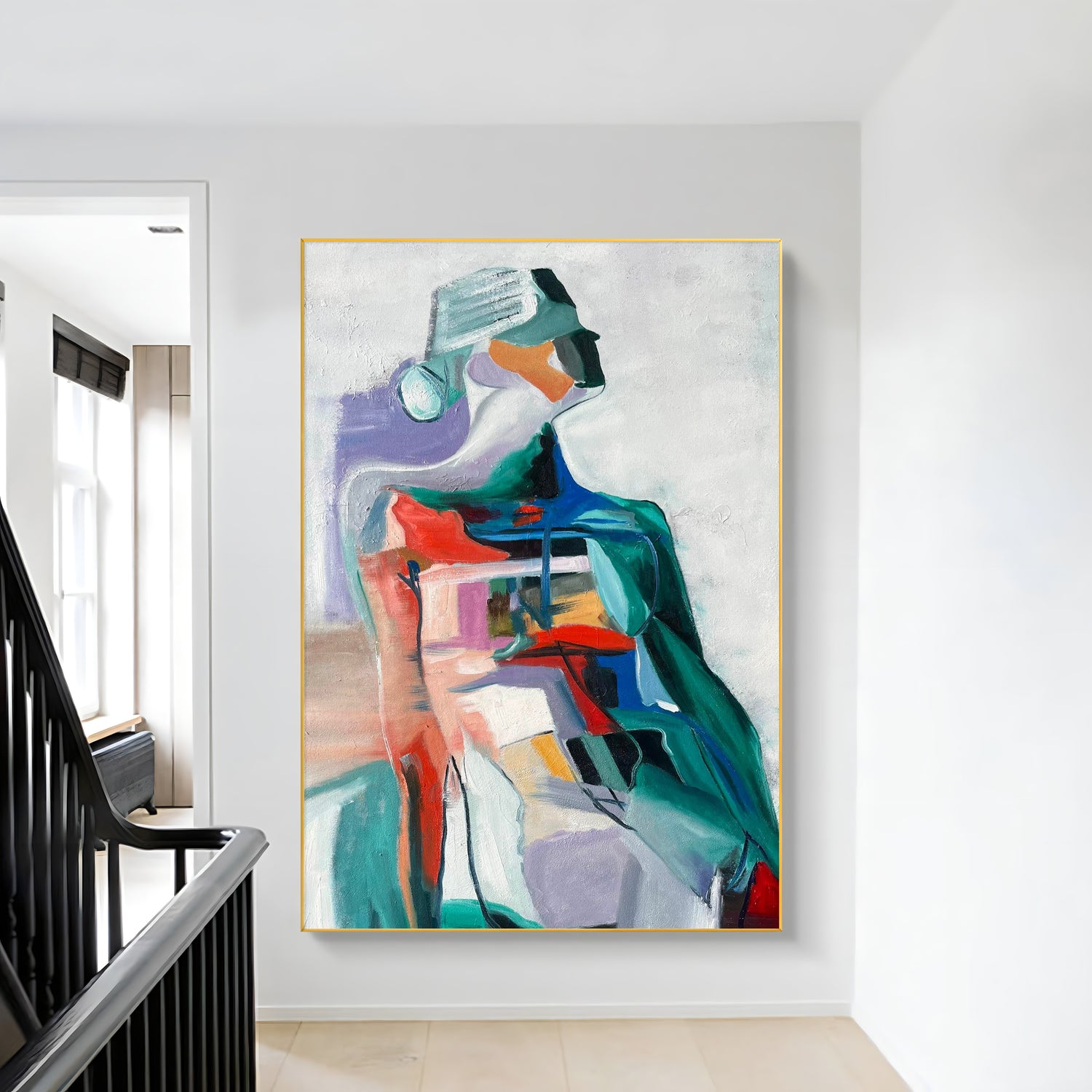 a painting hanging on a wall next to a banister