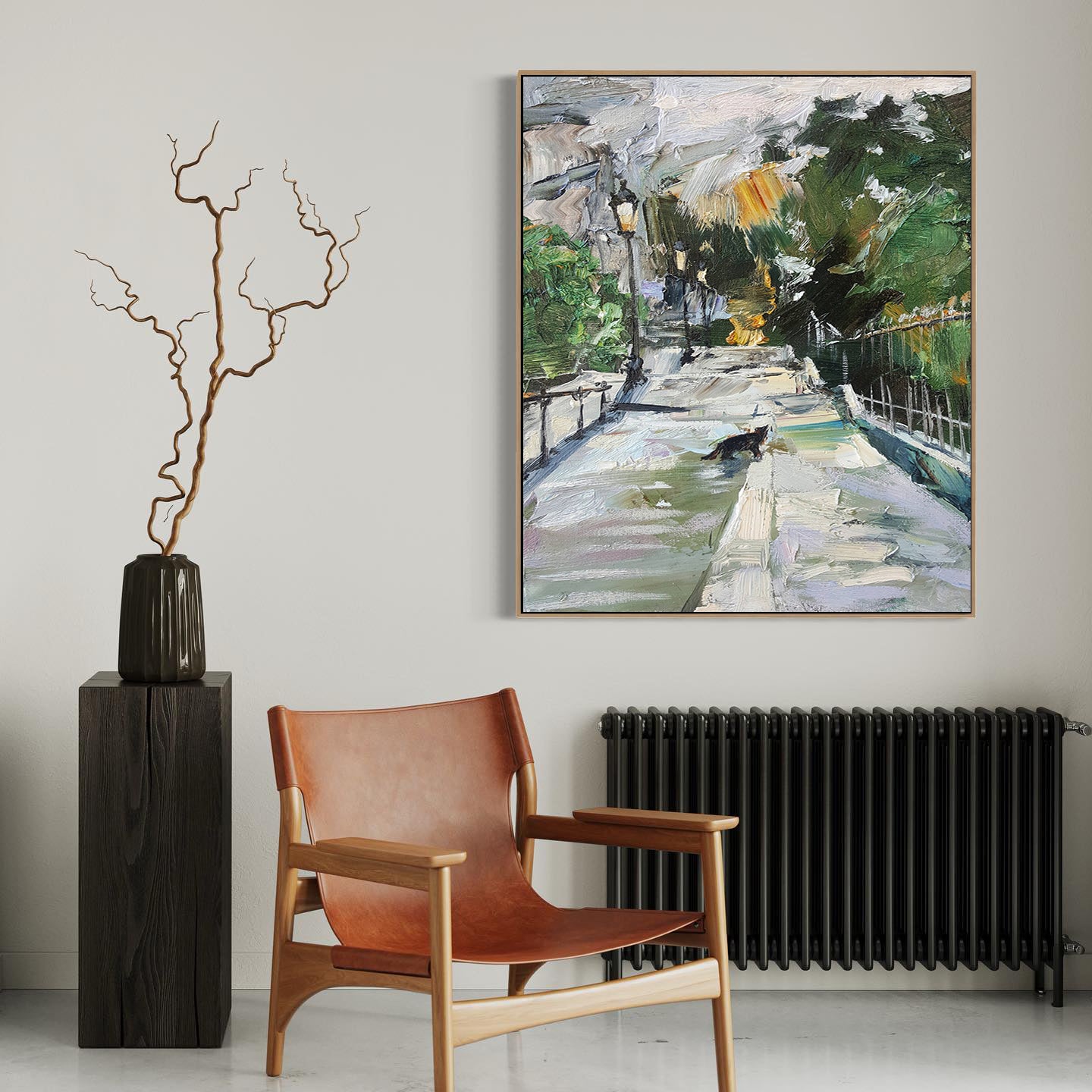 a painting hanging on a wall next to a chair