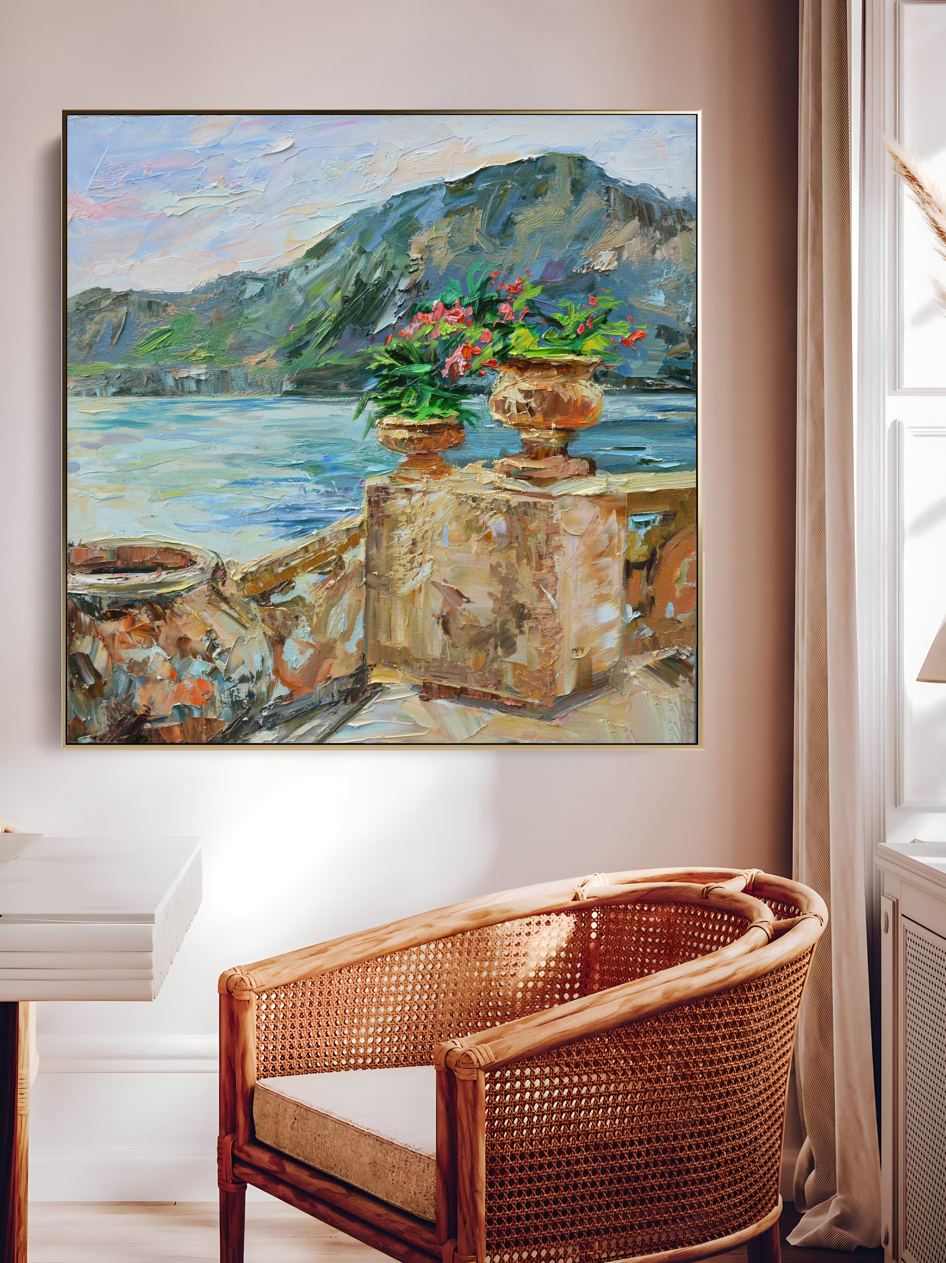 a painting on a wall above a wicker chair