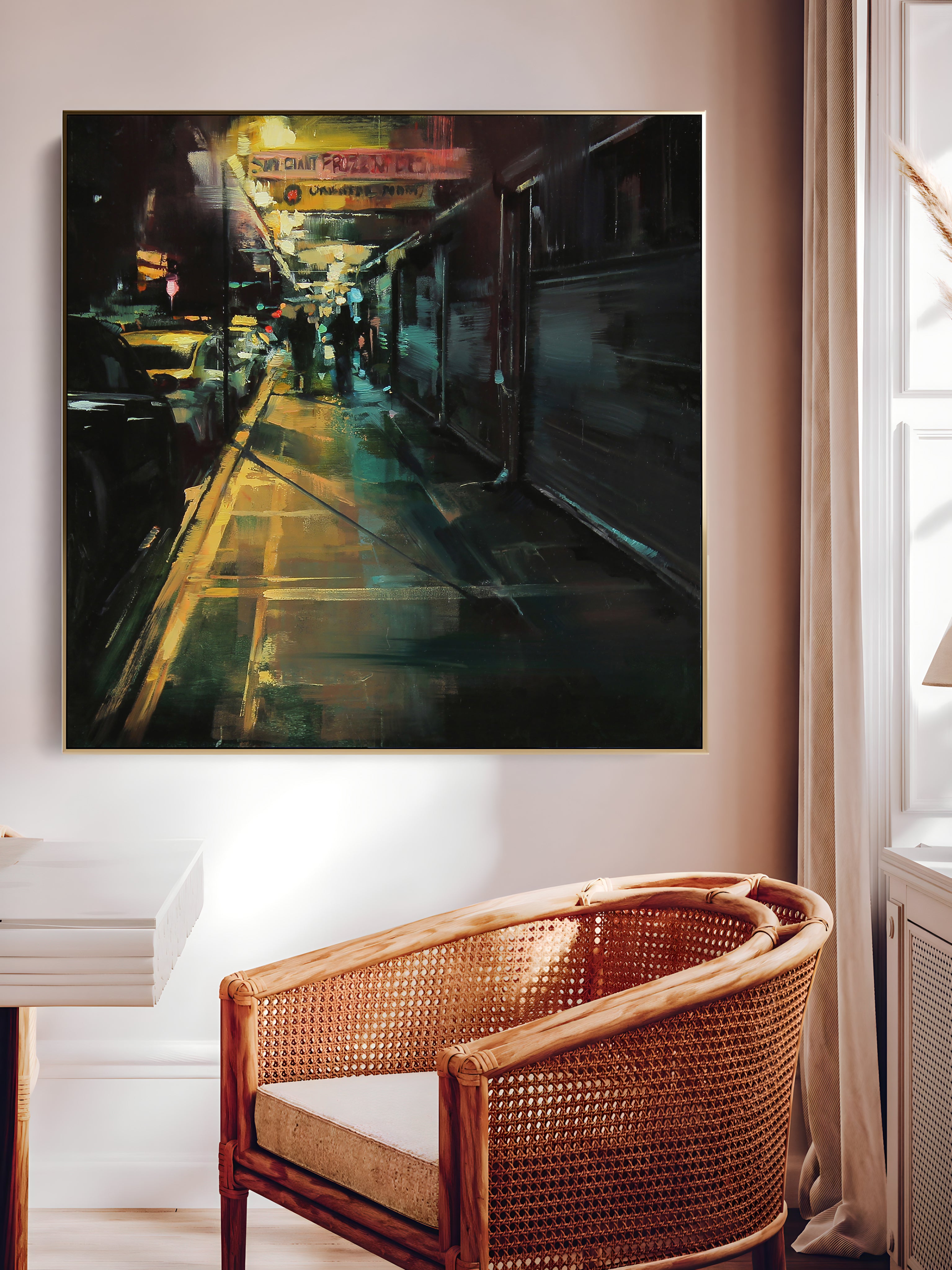 a painting hanging on a wall above a chair