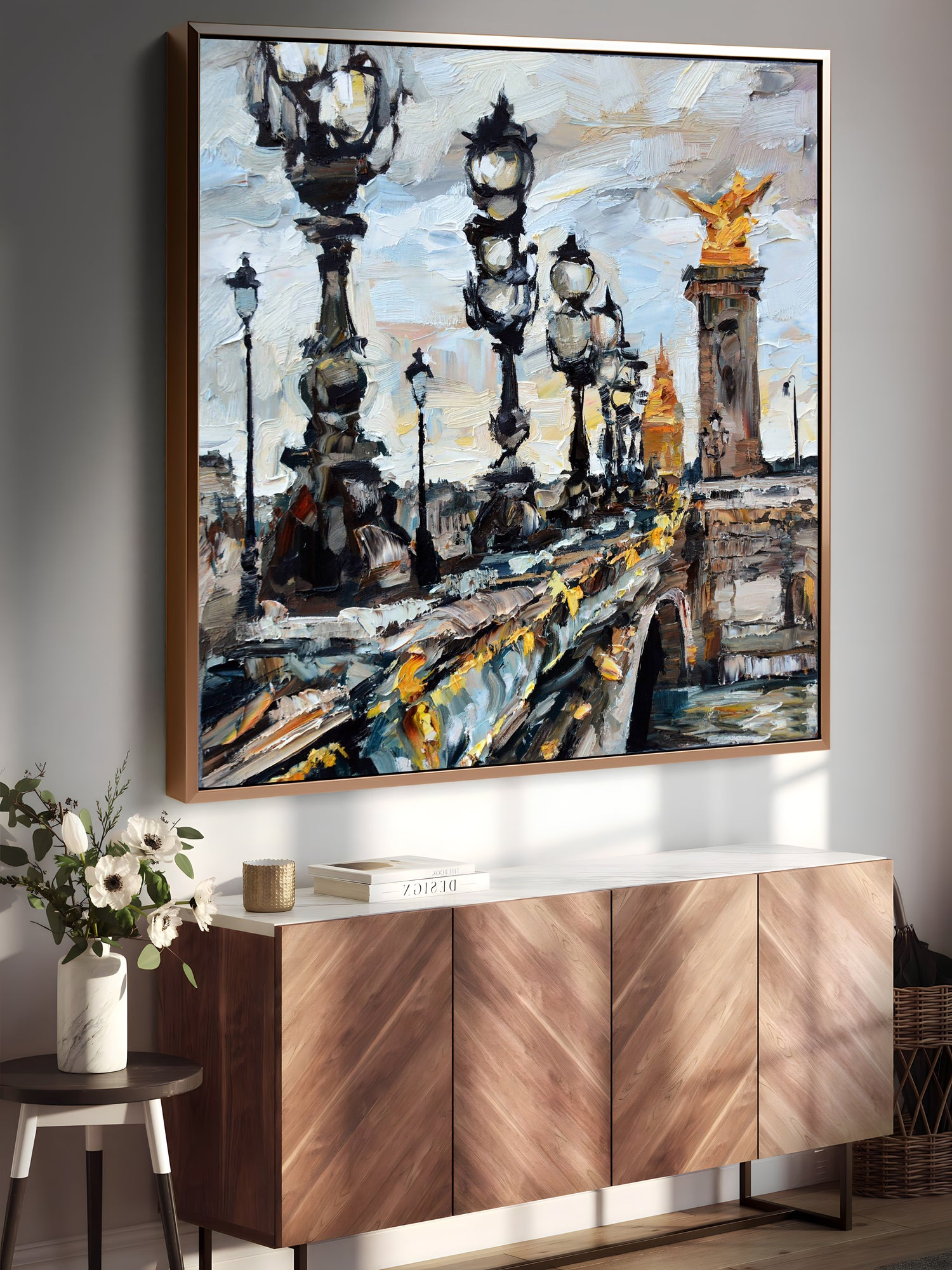 a painting hanging on a wall next to a sideboard