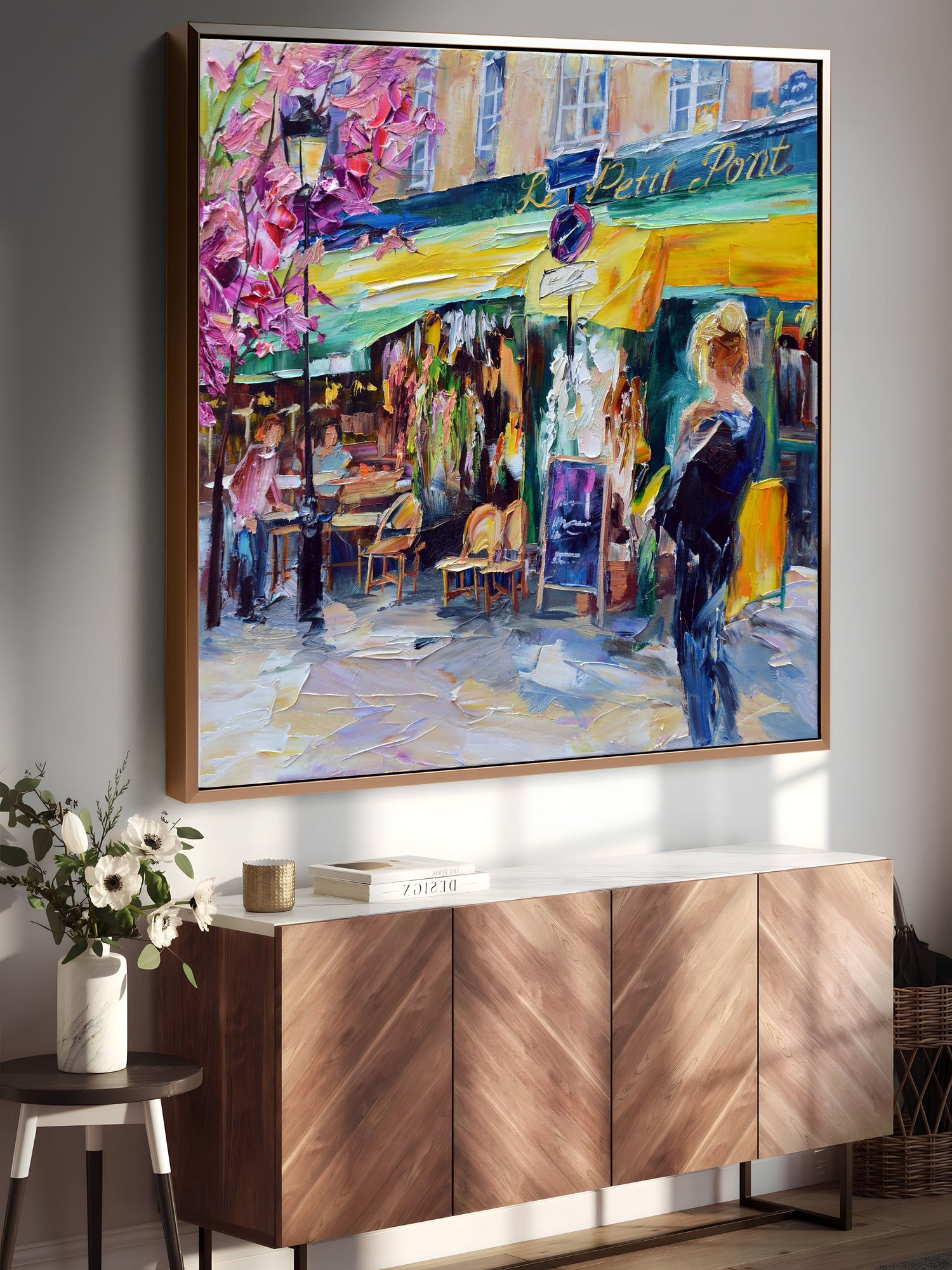 a painting hanging on a wall above a buffet