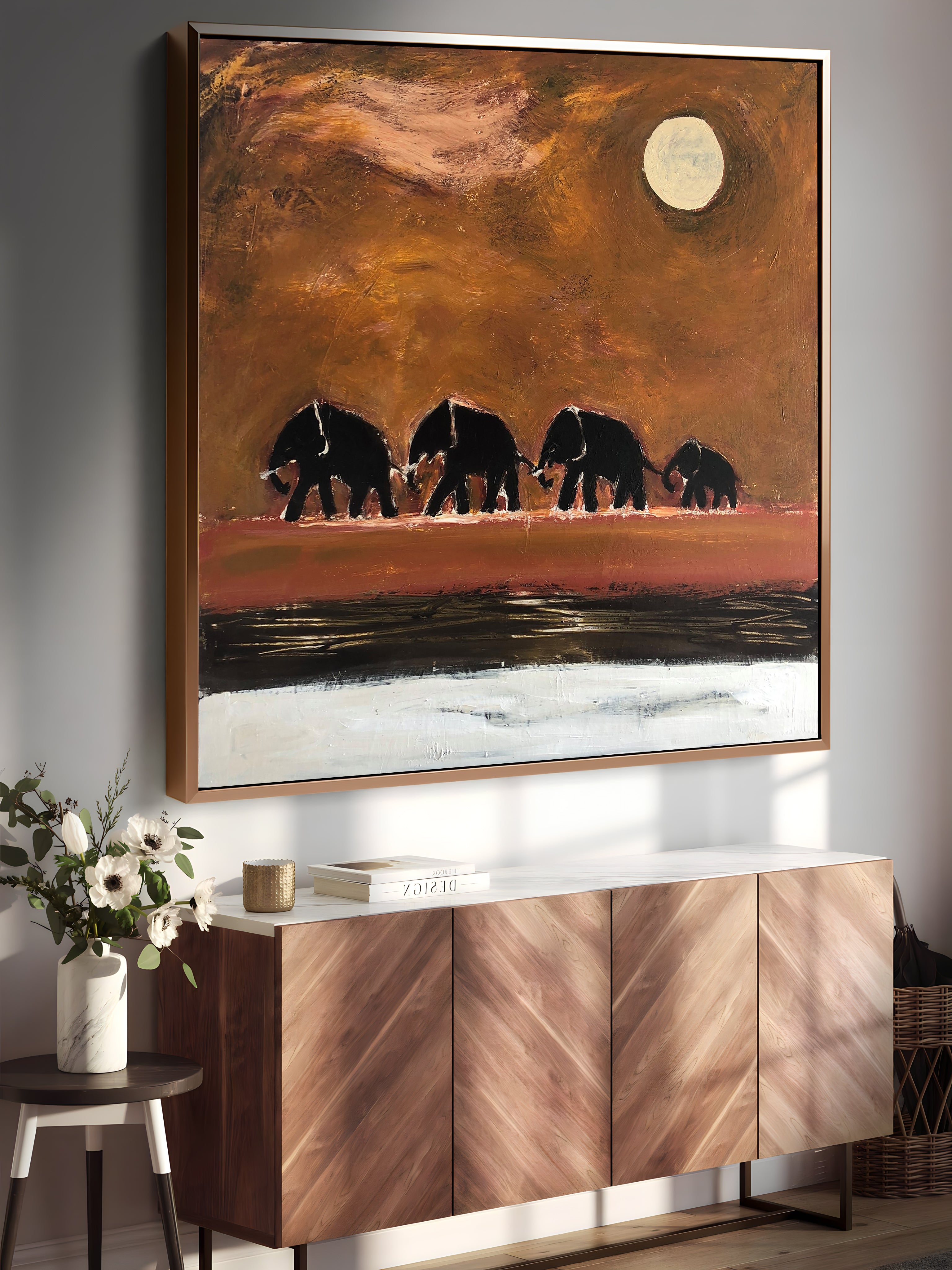 a painting of three elephants on a wall