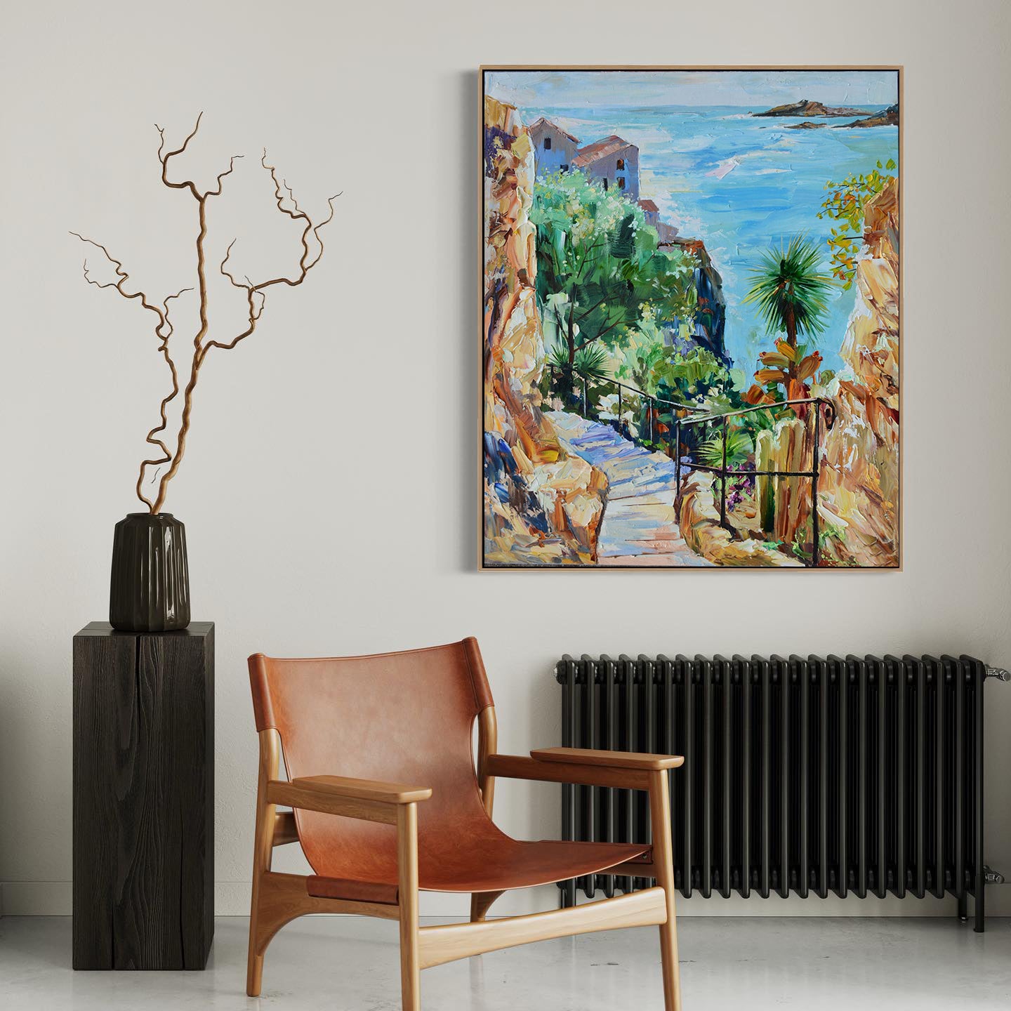 a painting hanging on a wall next to a chair