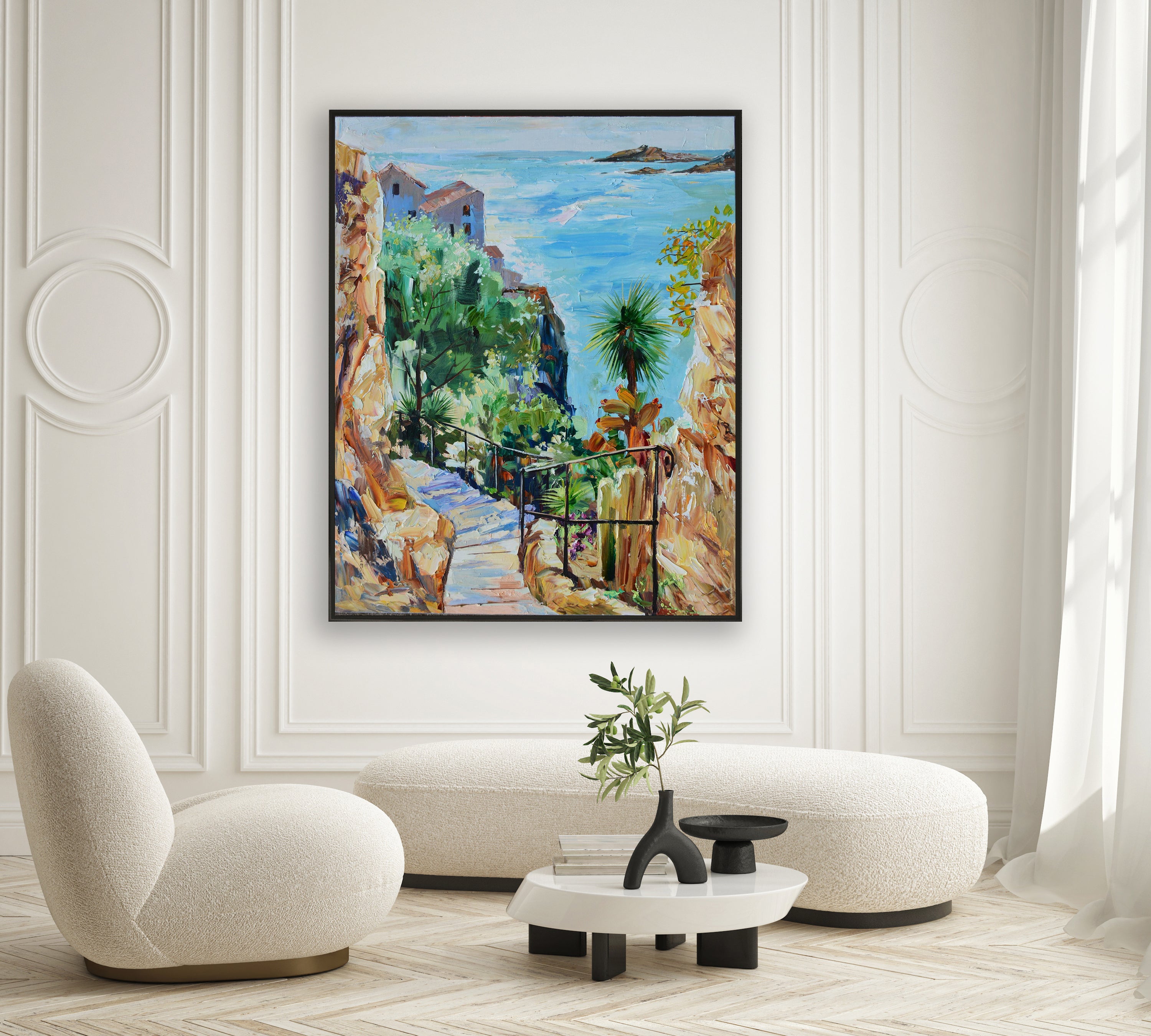 a living room with a painting on the wall