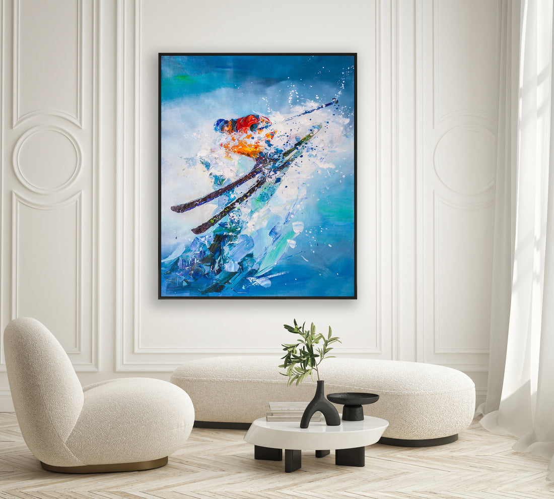 a living room with a painting of a skier on the wall